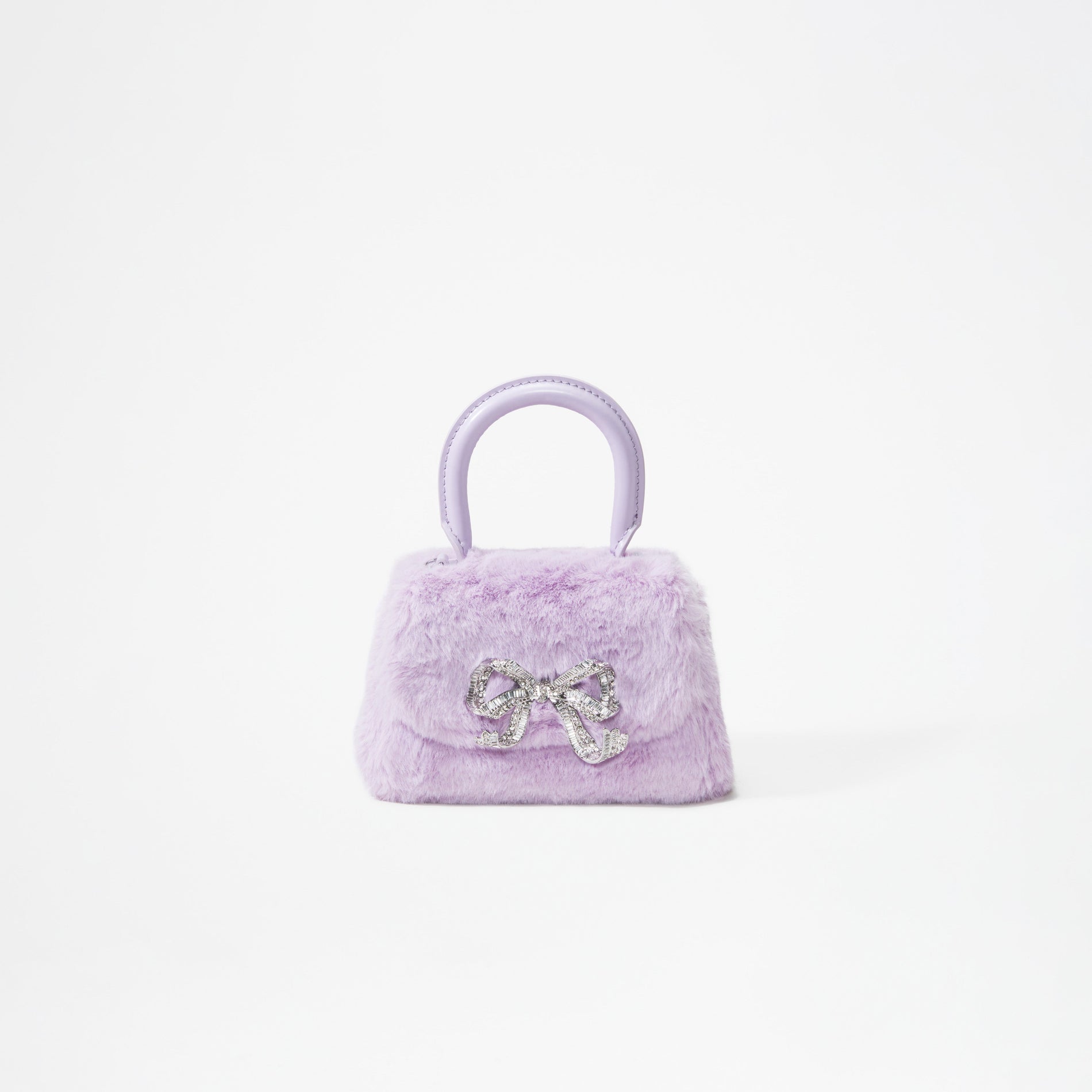A woman wearing the Lilac Fluffy Bow Micro Bag