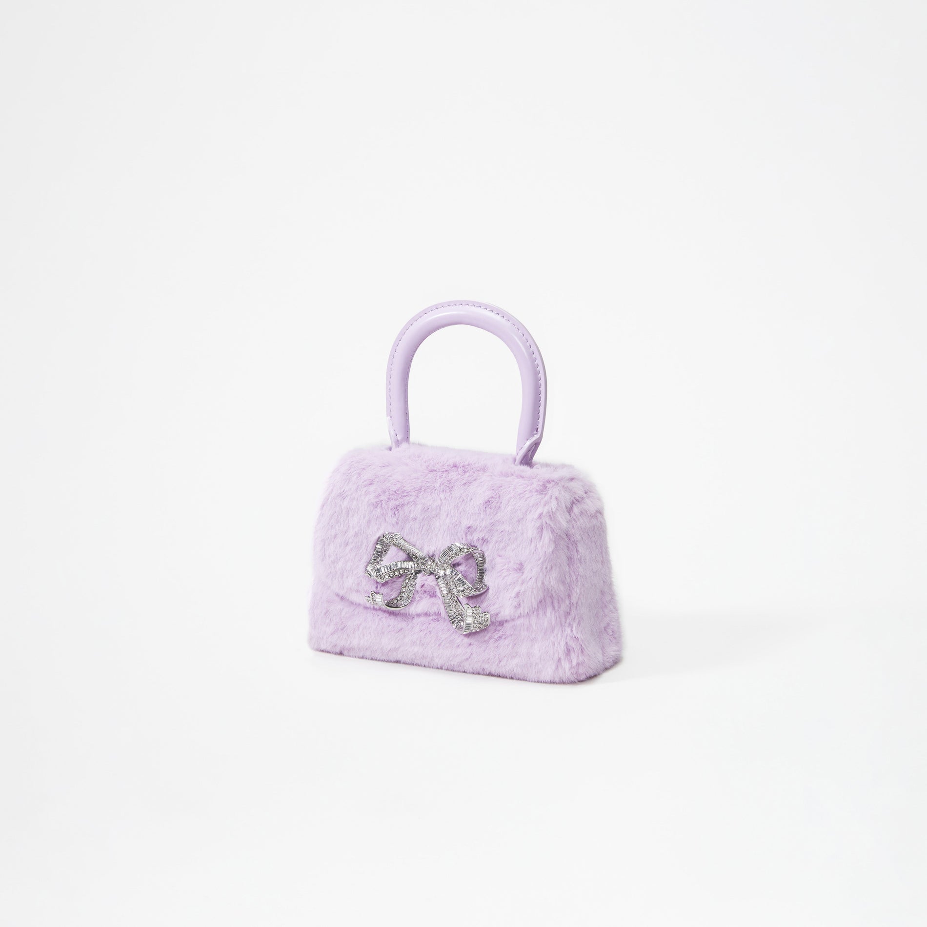 A woman wearing the Lilac Fluffy Bow Micro Bag