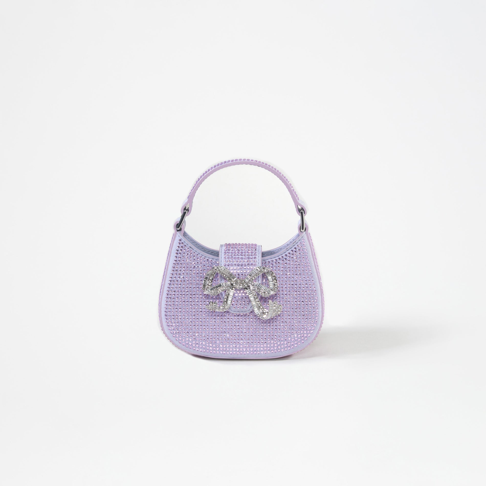 A woman wearing the Purple Rhinestone Crescent Bow Micro Bag