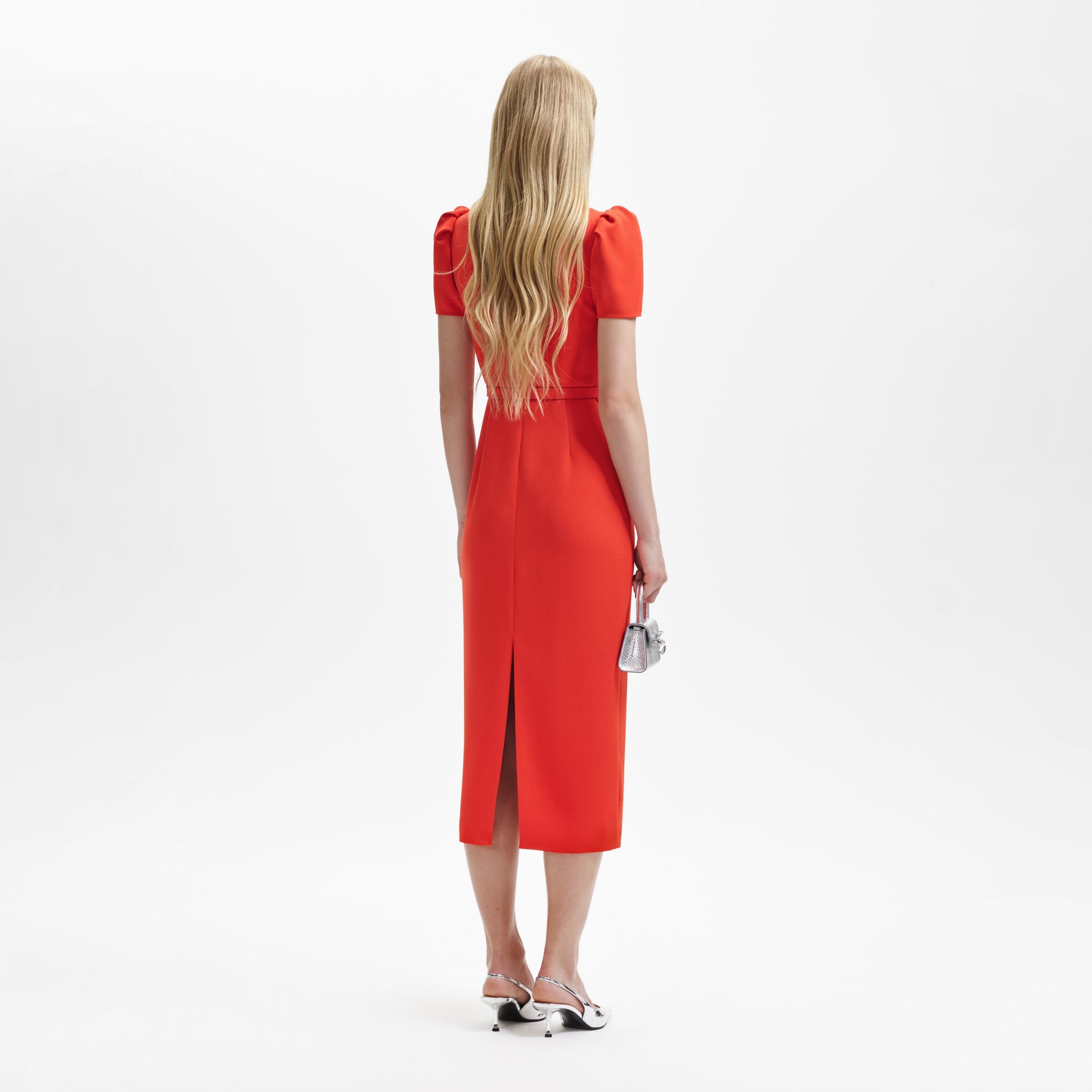 A woman wearing the Red Crepe Midi Dress