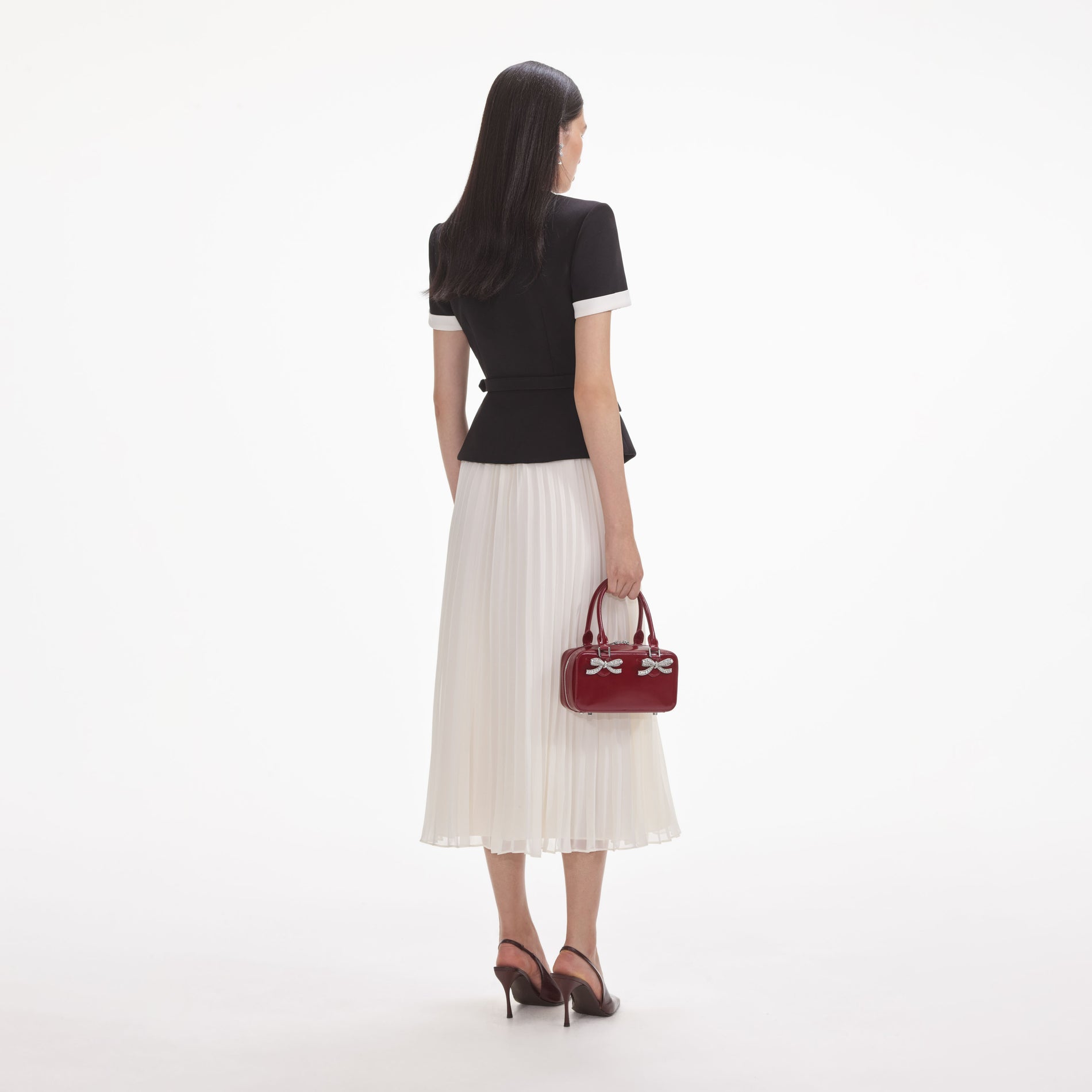 Back view of a woman wearing the White Black Crepe Contrast Chiffon Midi Dress