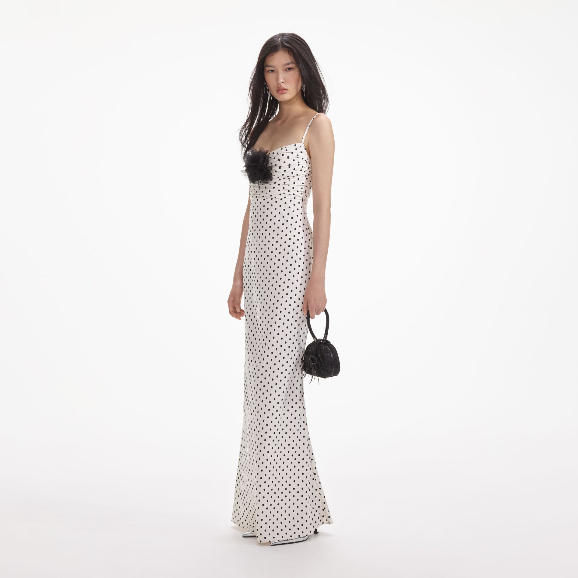 Side view of a woman wearing the Cream Polka Dot Satin Maxi Dress