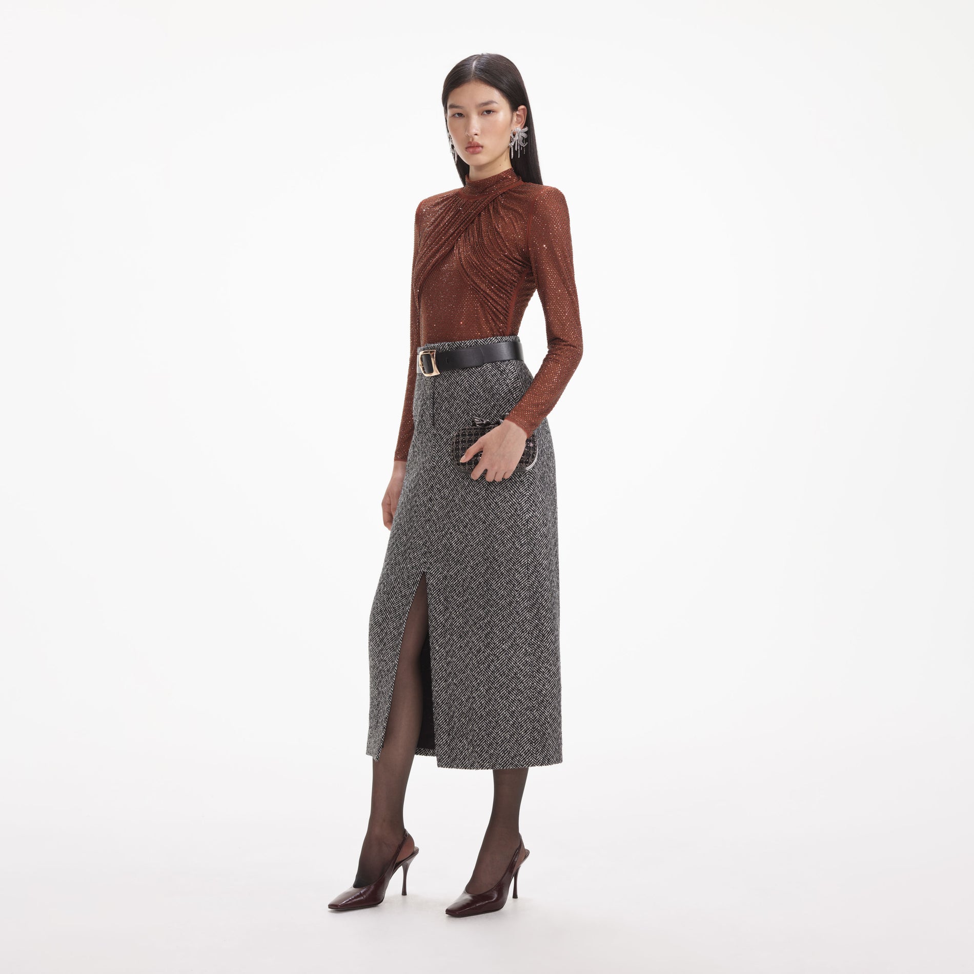 Side view of a woman wearing the Brown Rhinestone Mesh Top