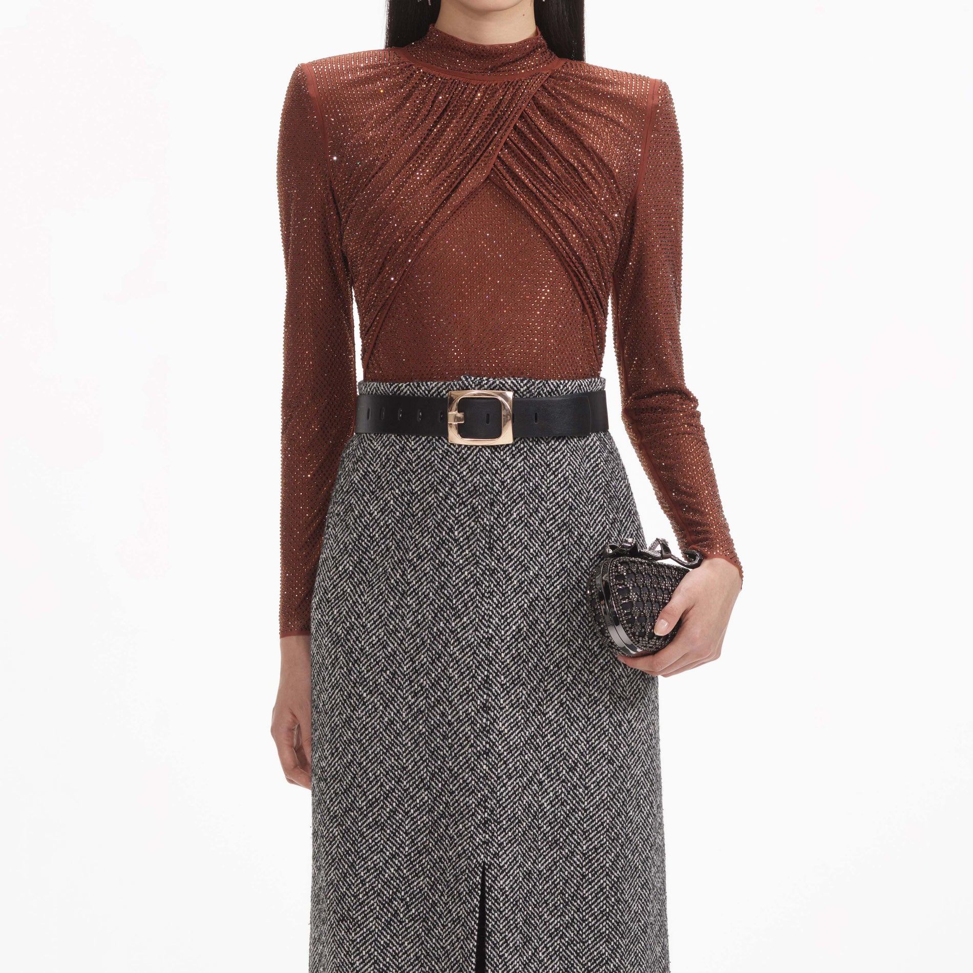 Side view of a woman wearing the Brown Rhinestone Mesh Top