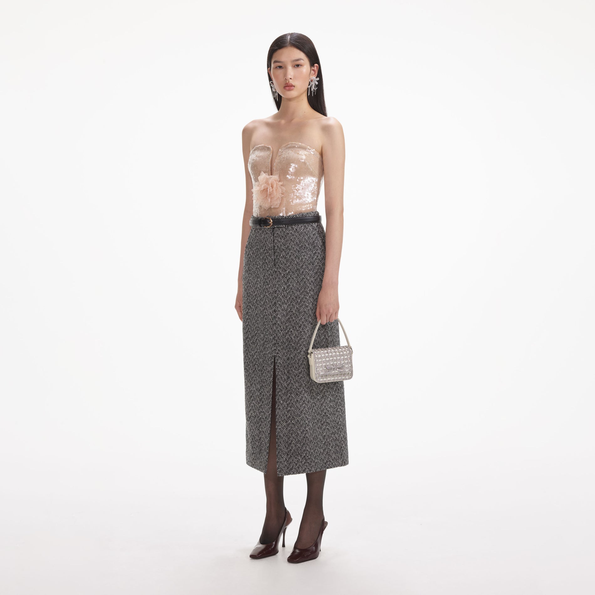 Side view of a woman wearing the Champagne Sequin Top