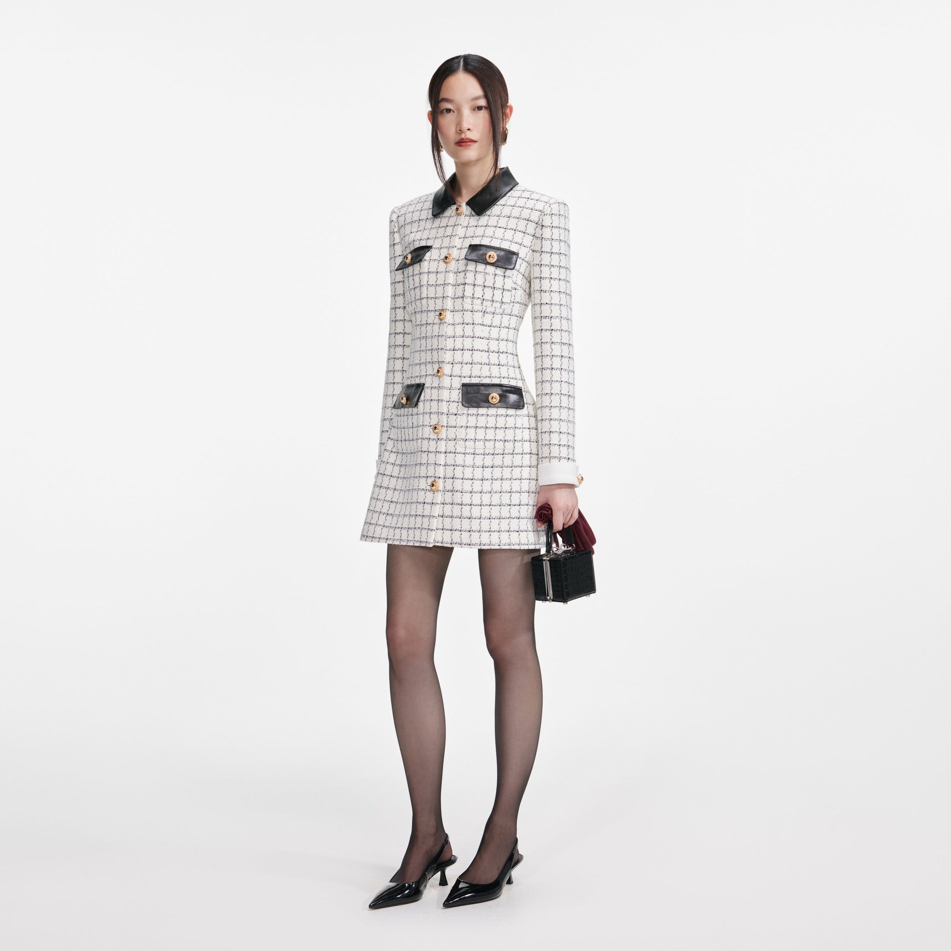 Side view of a woman wearing the Check Boucle Long Sleeve Mini Dress