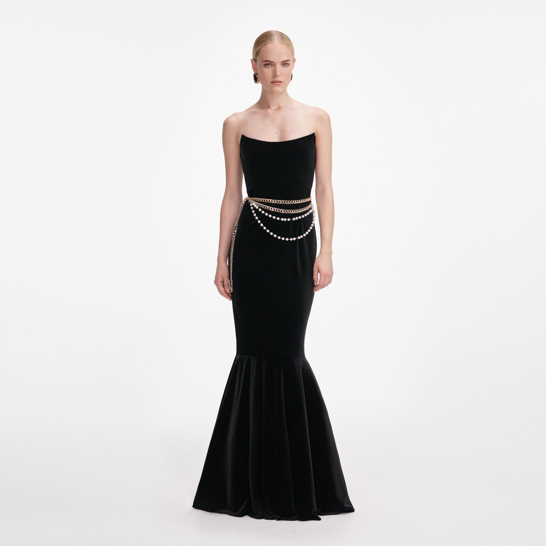 Front view of a woman wearing the Black Velvet Chain Belt Maxi Dress