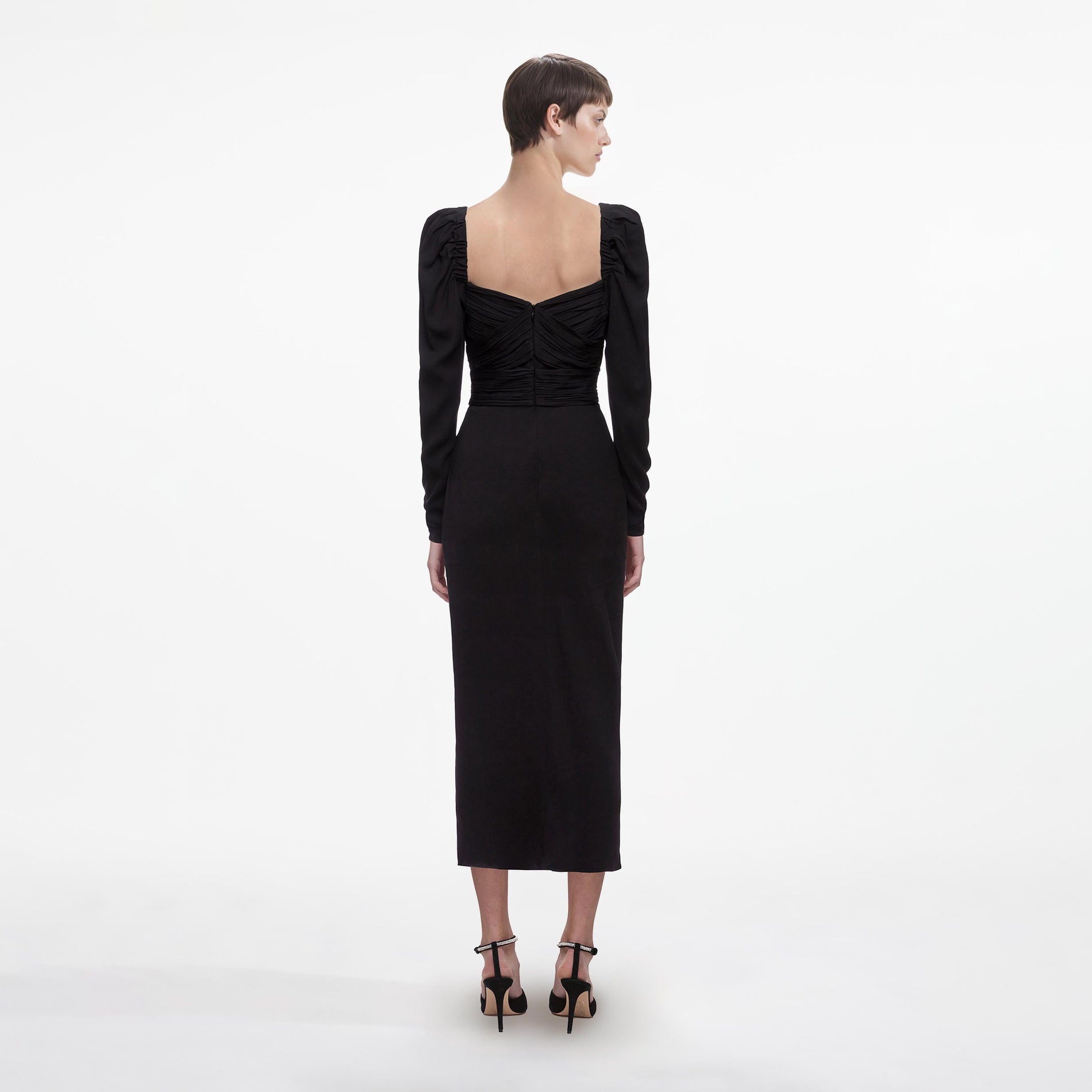 Back view of a woman wearing the Black Iris Midi Dress