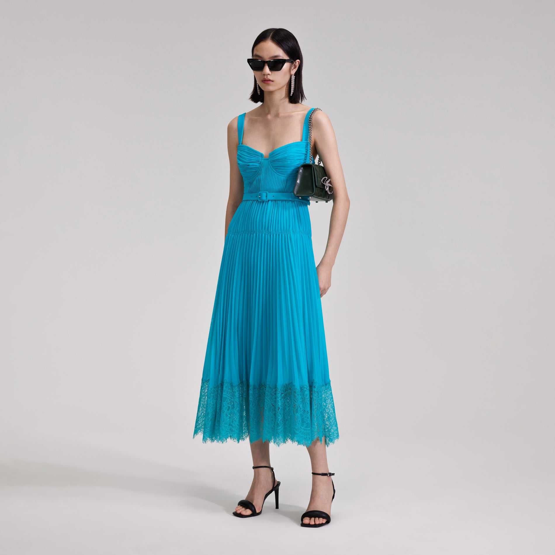 A woman wearing the Blue Chiffon Lace Midi Dress