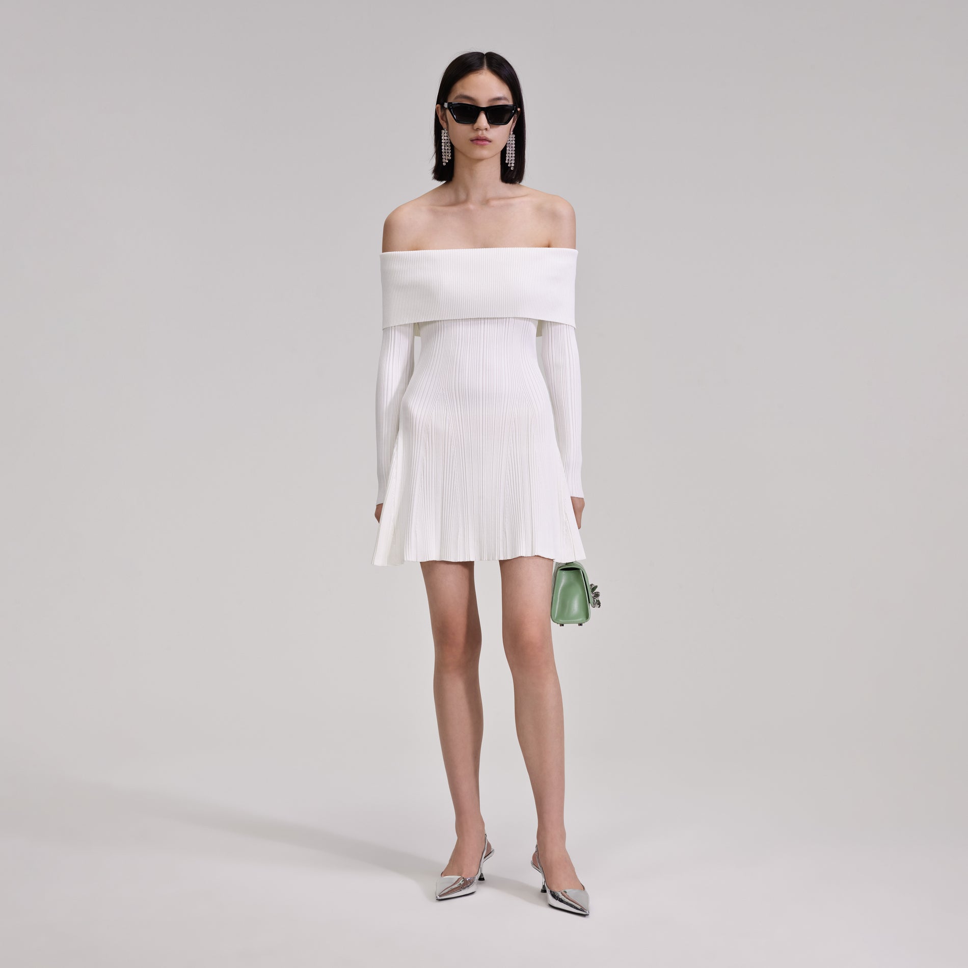 A woman wearing the White Knit Mini Dress