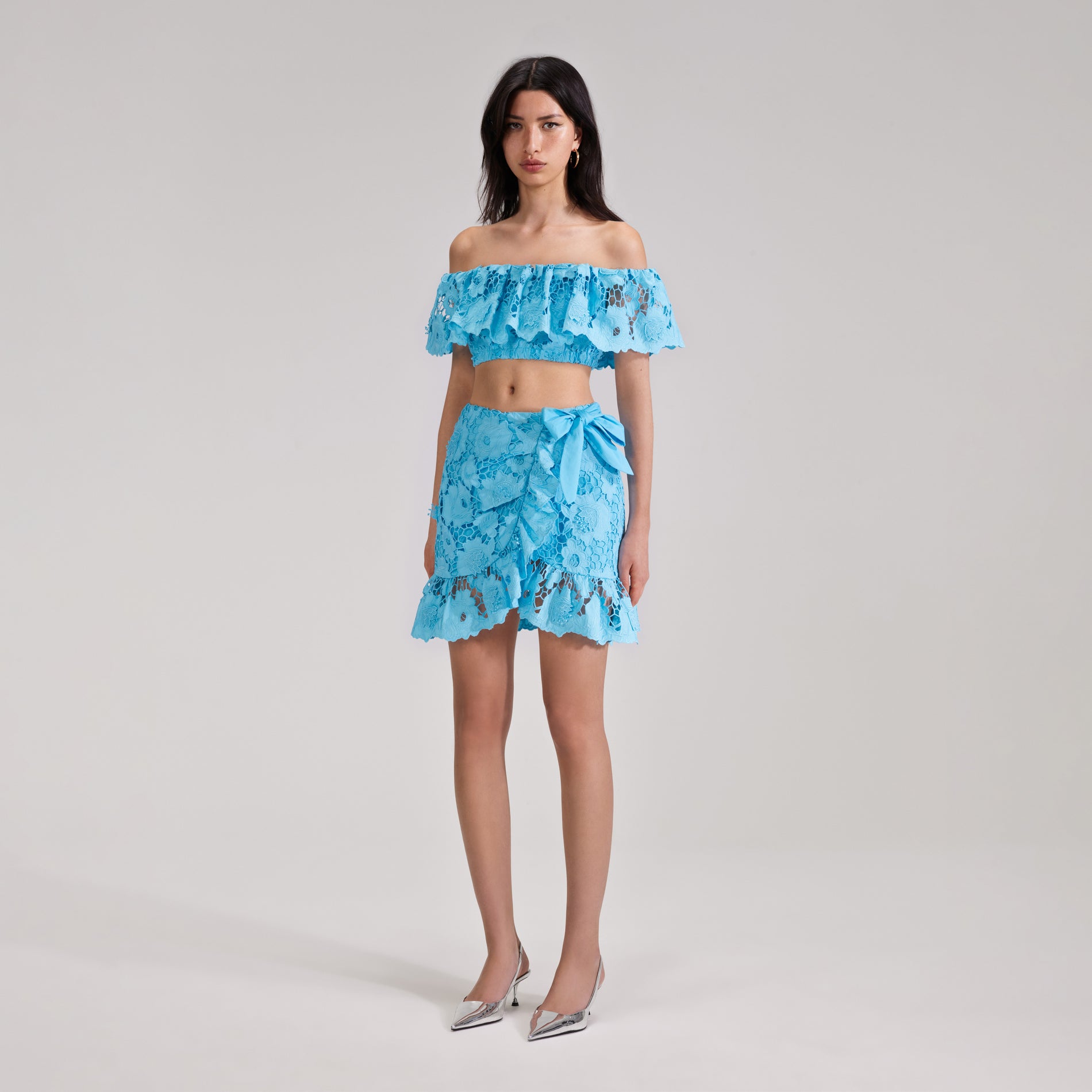 A woman wearing the Blue Lace Top