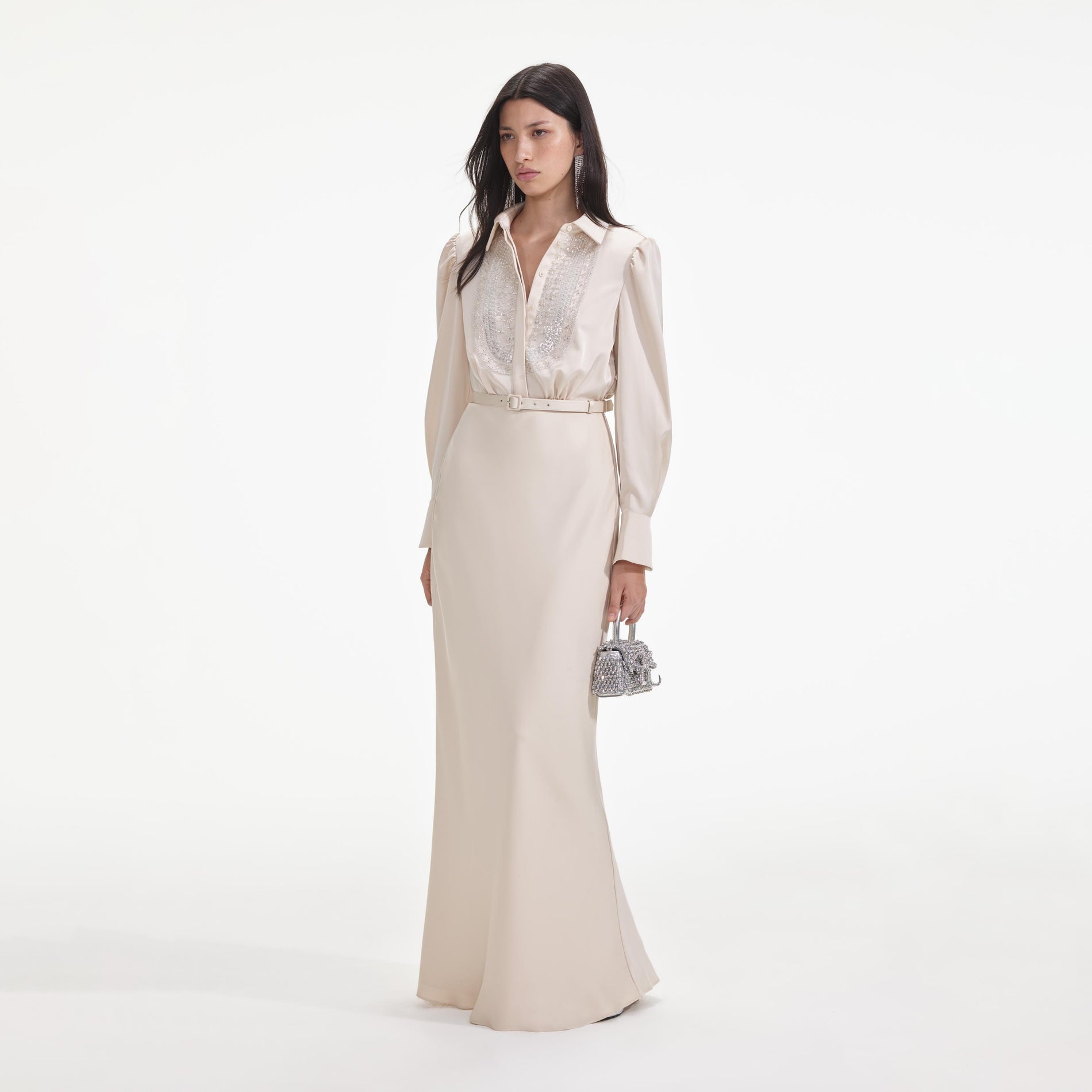 Side view of a woman wearing the Cream Satin Embellished Bib Maxi Dress