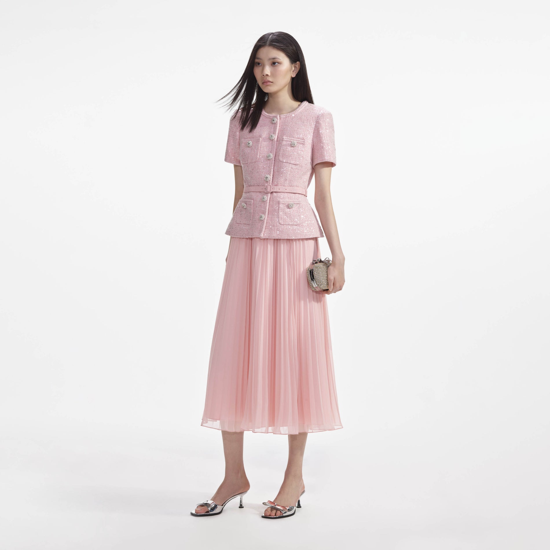 Side view of a woman wearing the Pink Boucle Midi Dress