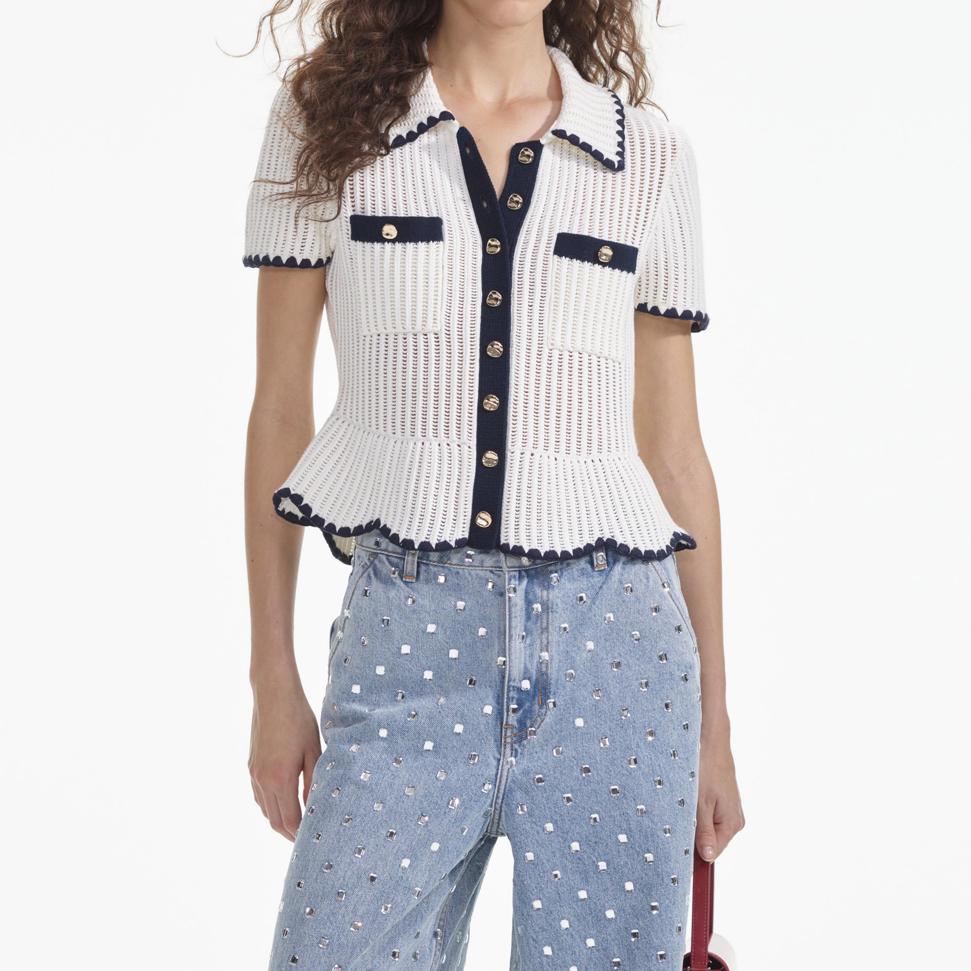 A close up of a woman wearing the Cream Crochet Top