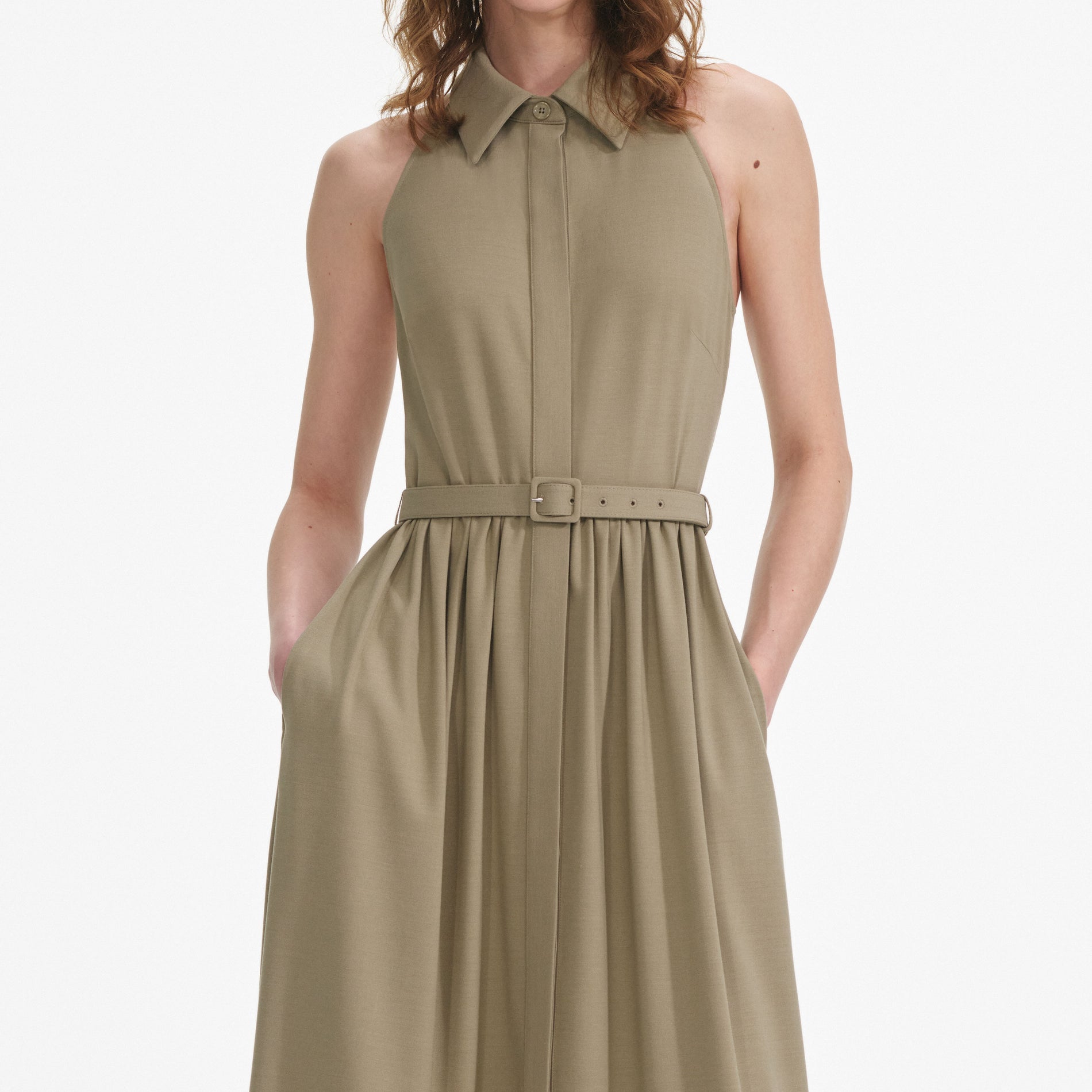 A close up of a woman wearing the Beige Sleeveless Twill Maxi Dress
