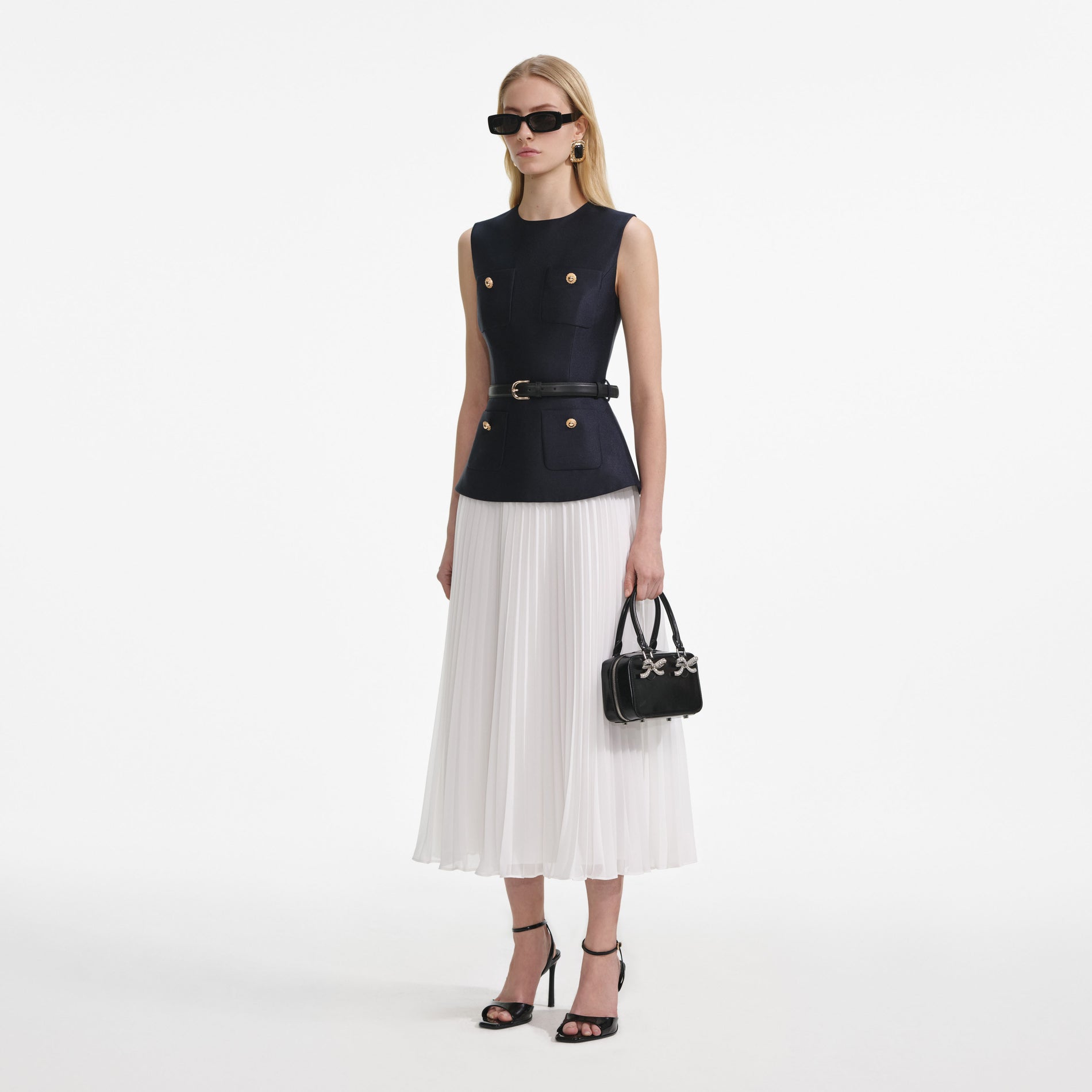 Side view of a woman wearing the Navy Taffeta Midi Dress