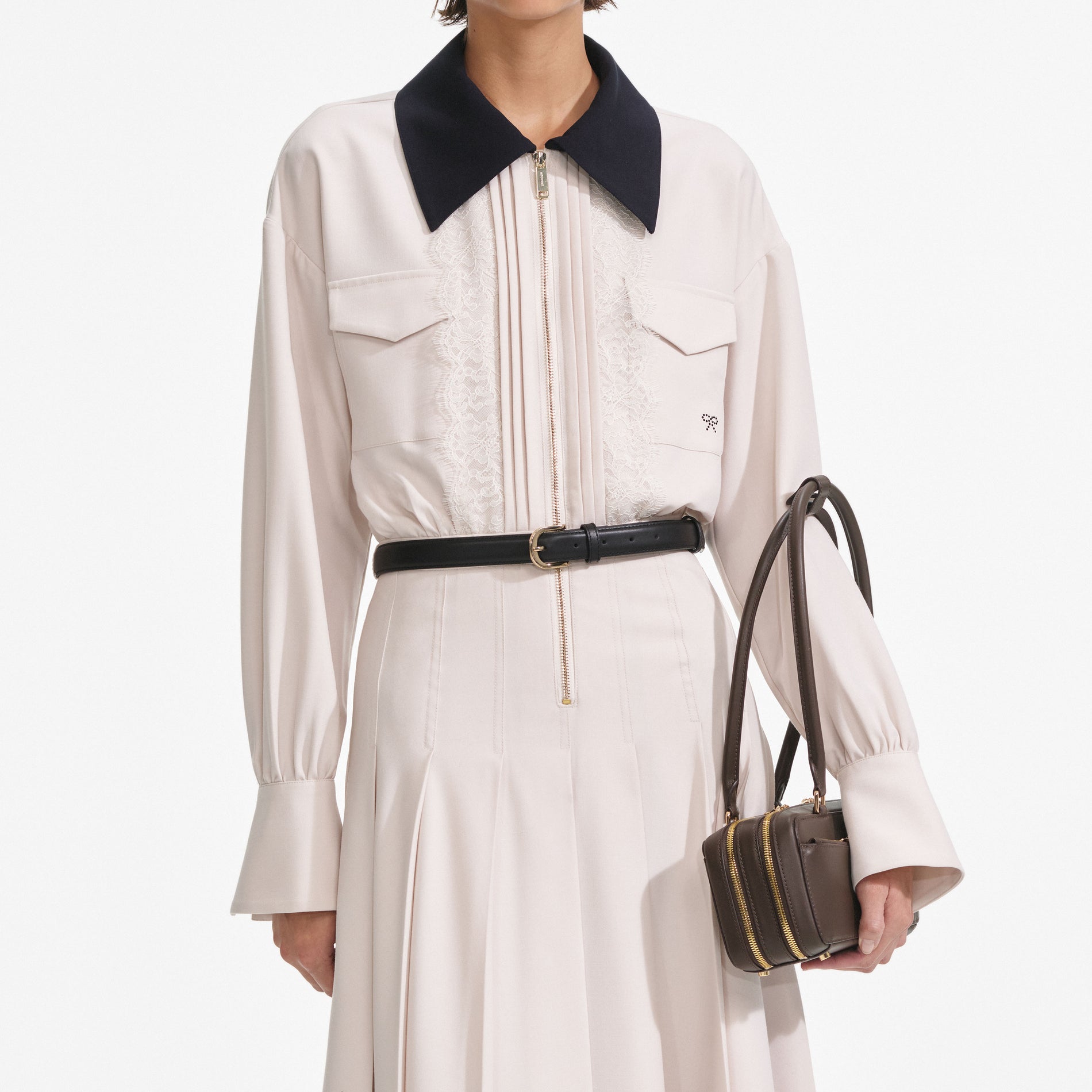 A close up of a woman wearing the Cream Twill Contrast Collar Midi Dress