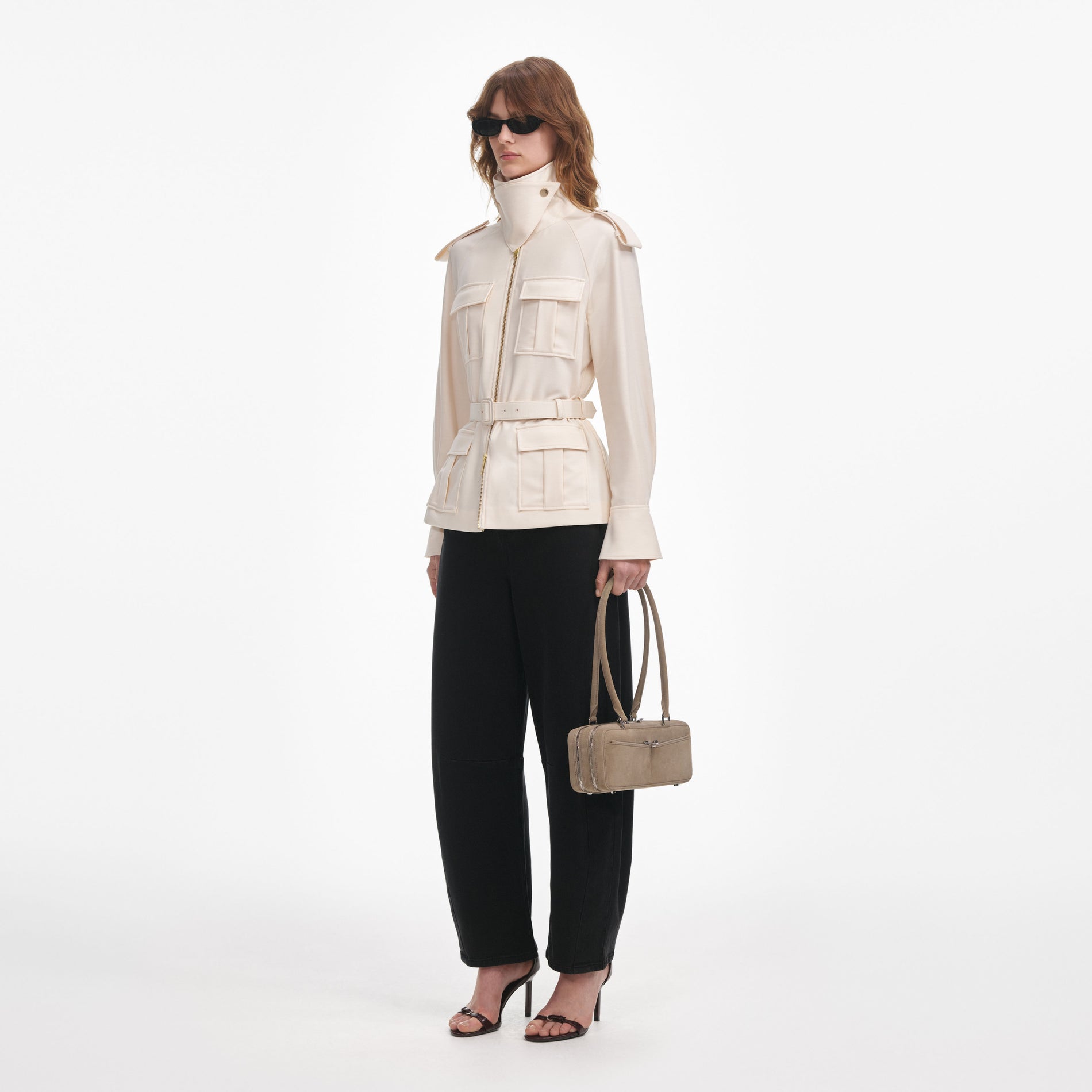 Side view of a woman wearing the Cream Twill Jacket