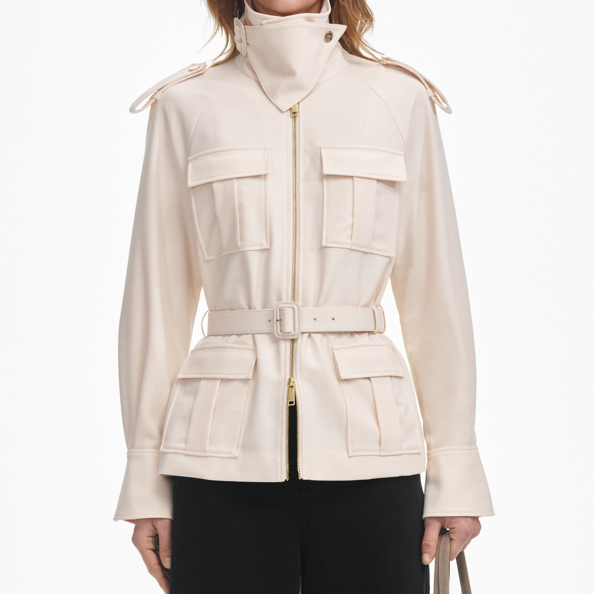A close up of a woman wearing the Cream Twill Jacket