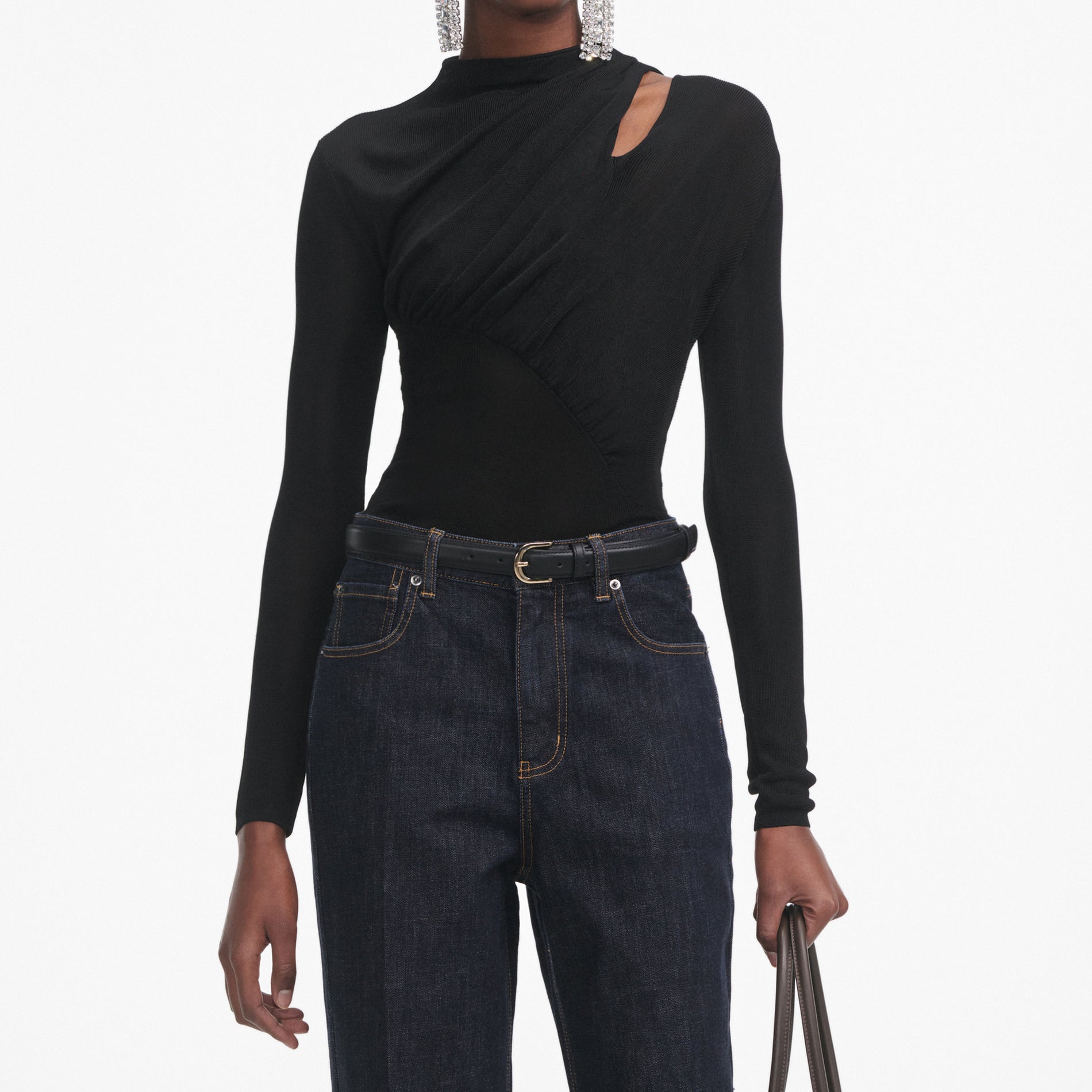 A close up of a woman wearing the Black Cut Out Viscose Knit Top