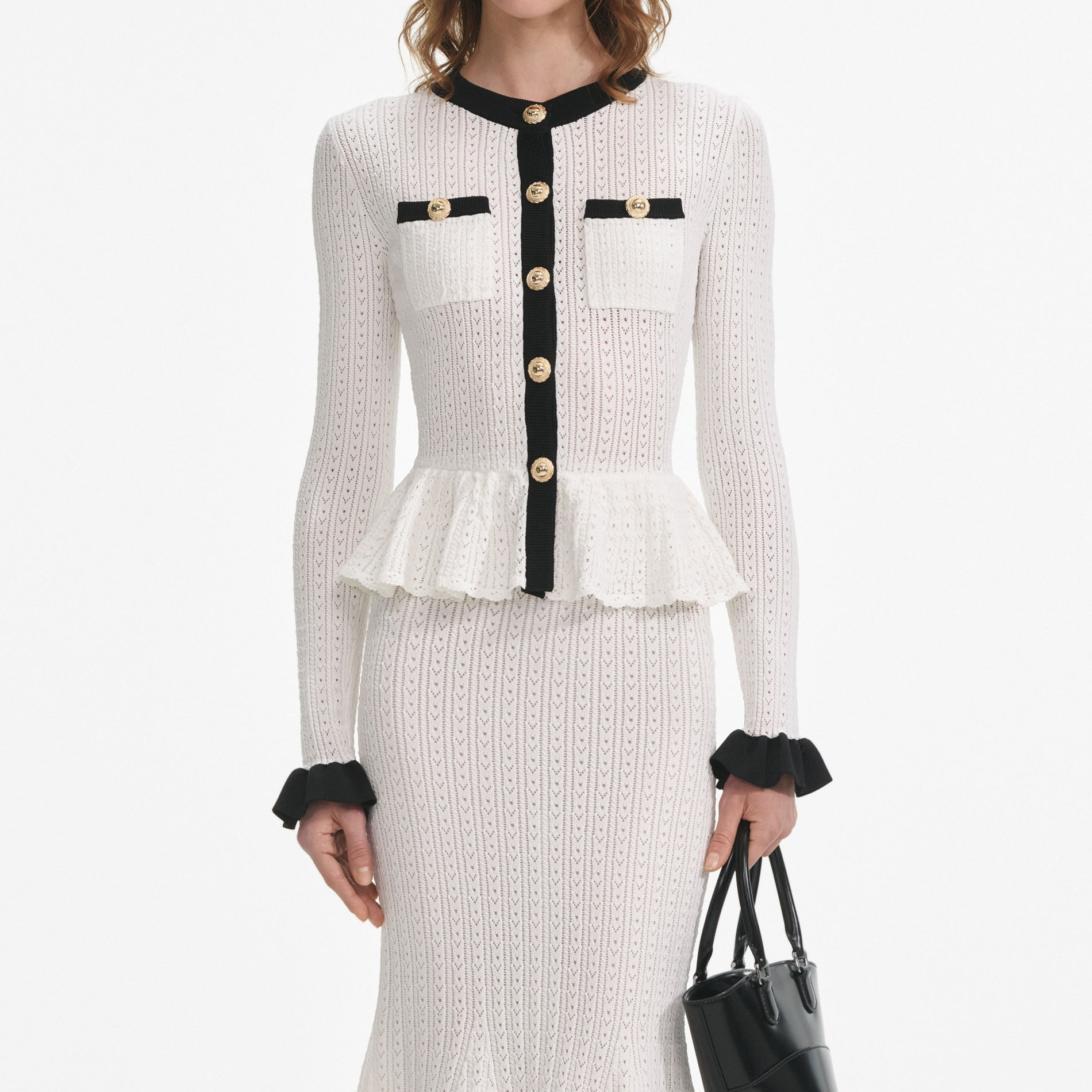 A close up of a woman wearing the White Pointelle Knit Contrast Midi Dress