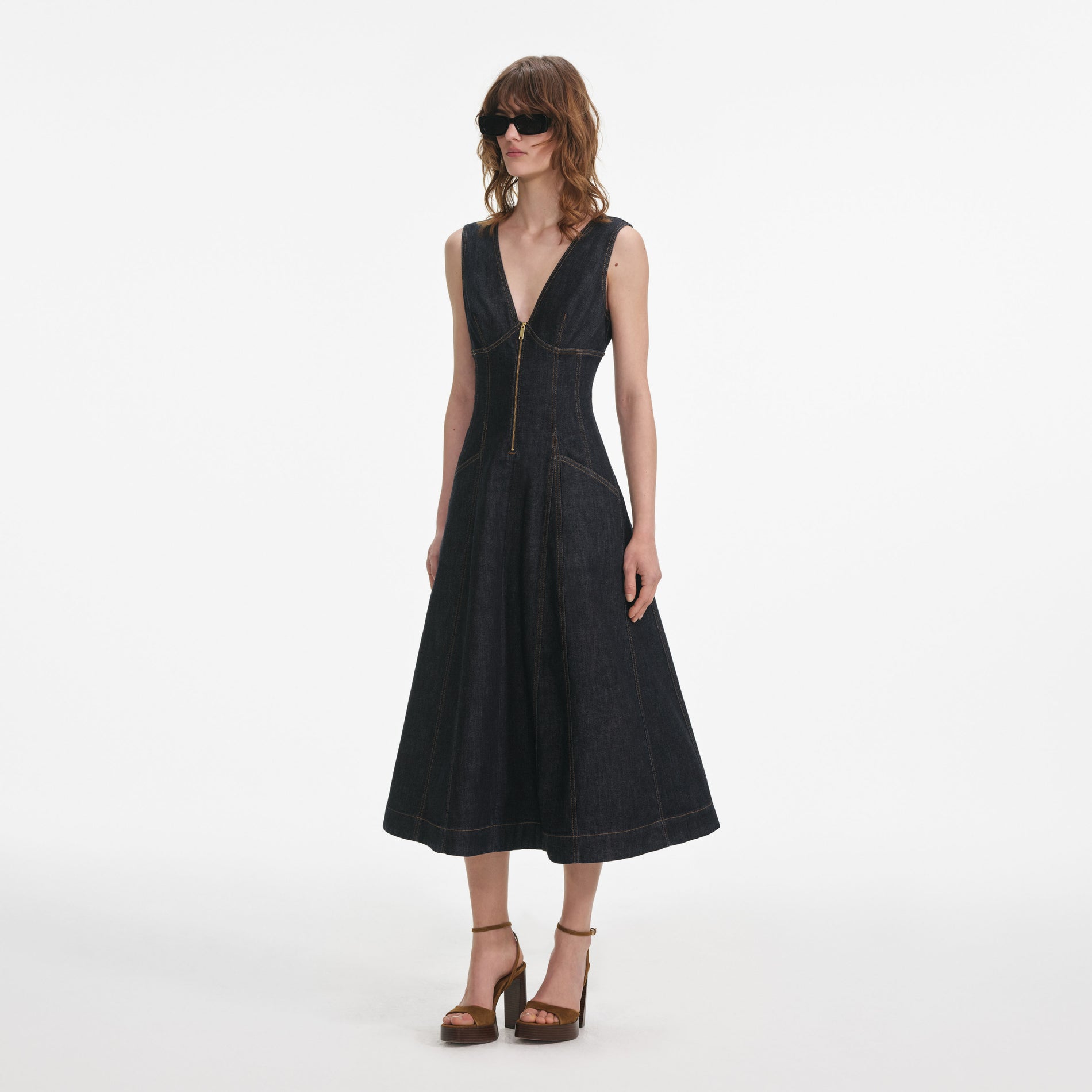 Side view of a woman wearing the Indigo Denim Midi Dress
