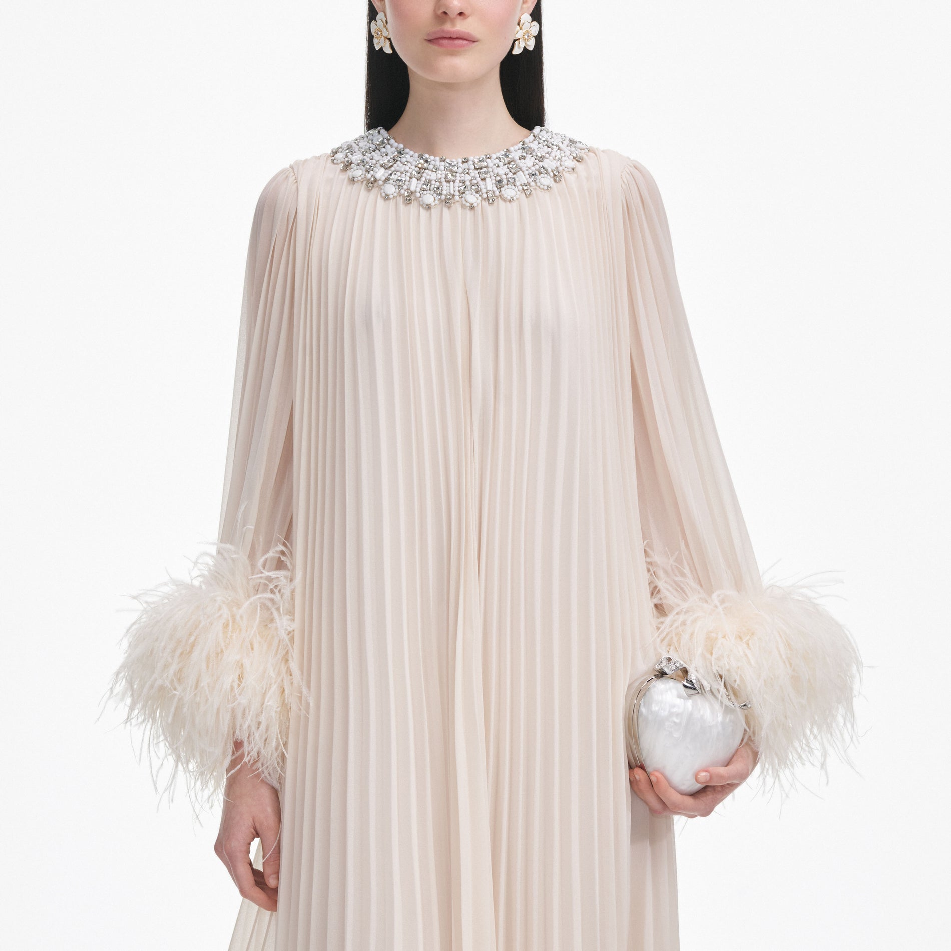 A close up of a woman wearing the Cream Chiffon Feather Midi Dress