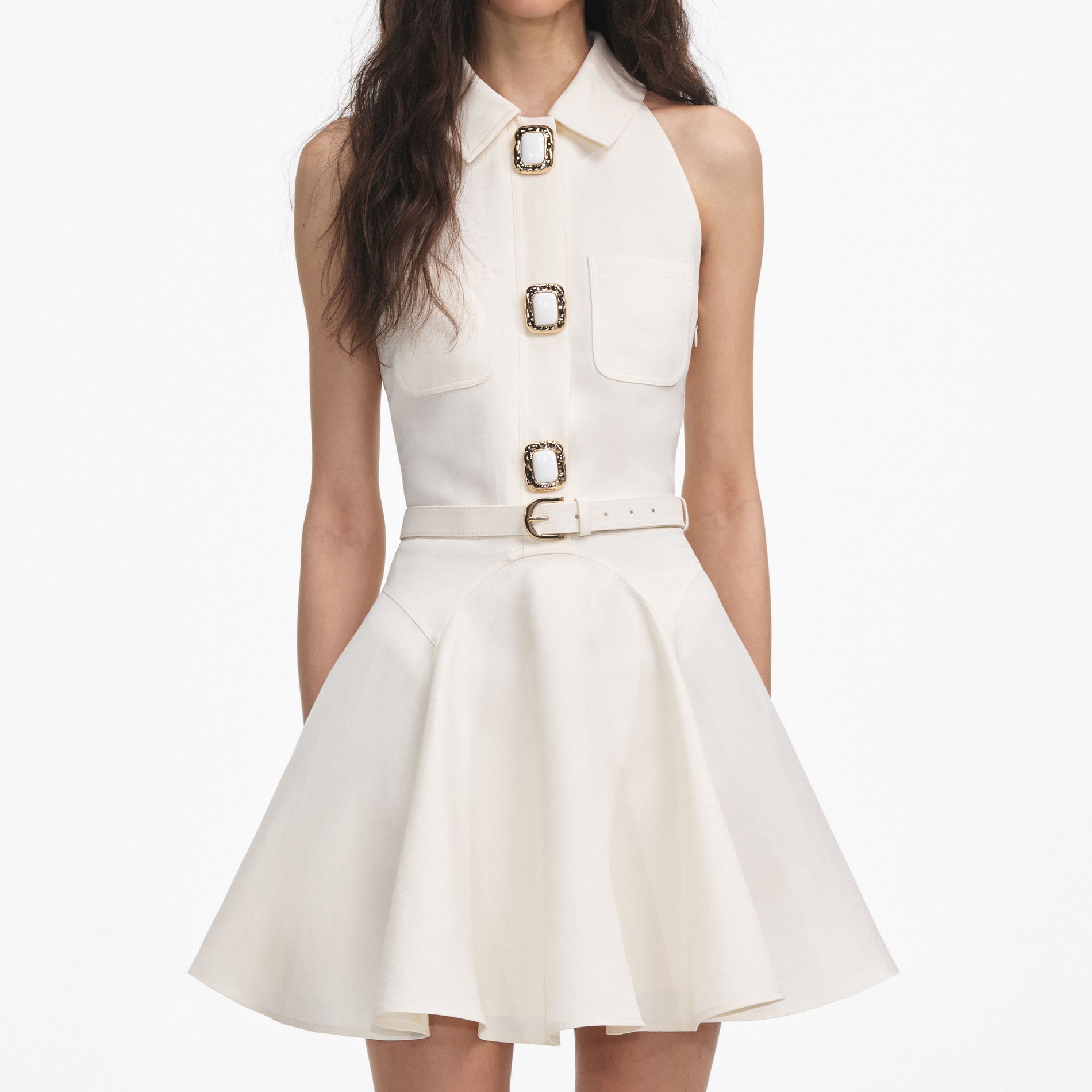A close up of a woman wearing the Cream Linen Mini Dress