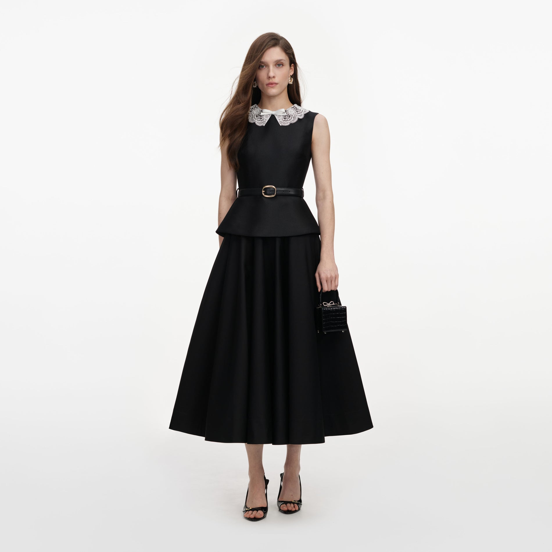 Front view of a woman wearing the Black Taffeta Peplum Midi Dress