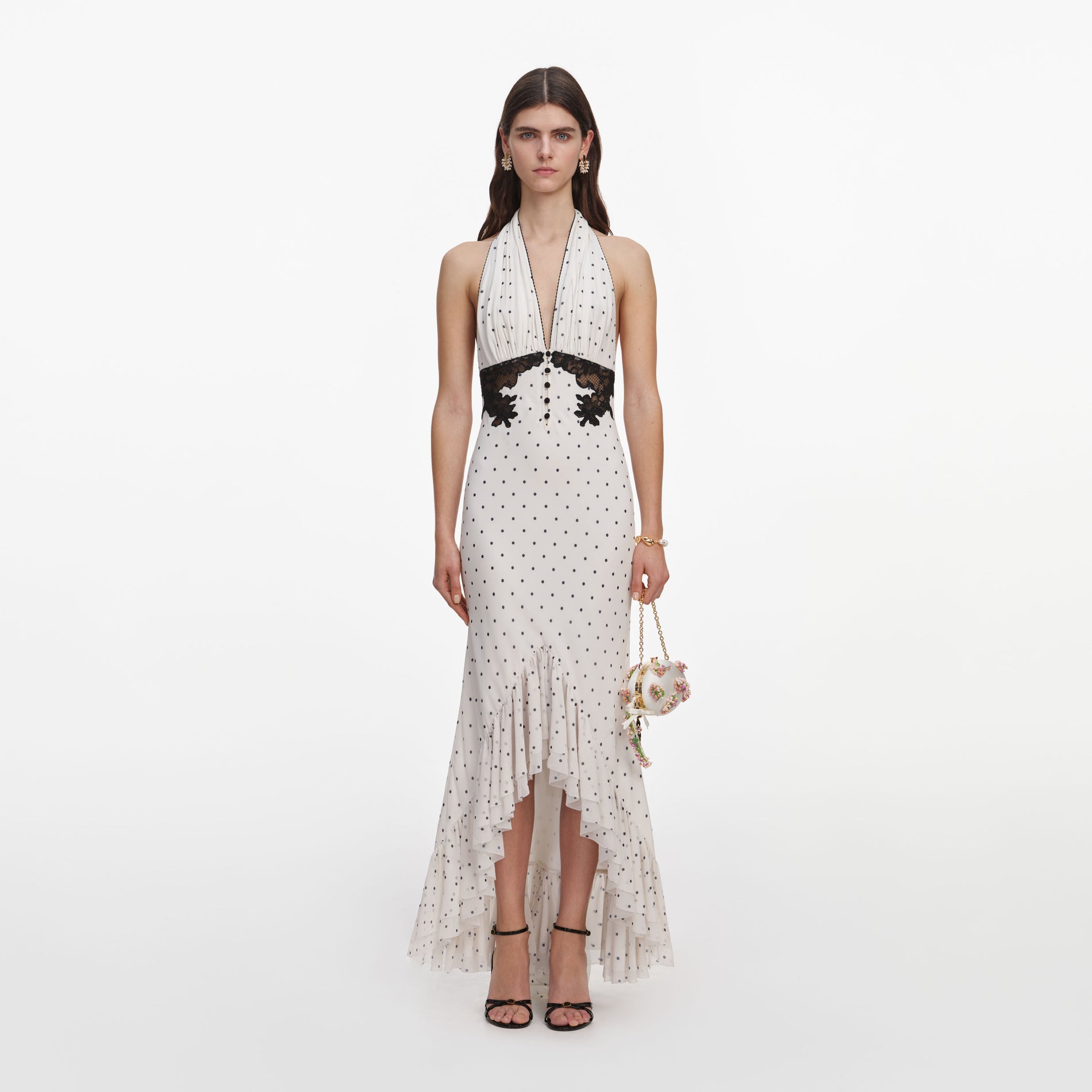 Front view of a woman wearing the Polka Dot Halter Neck Midi Dress