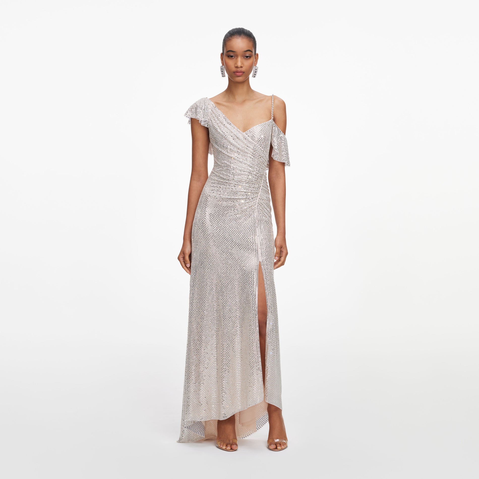 Front view of a woman wearing the Champagne Rhinestone Ruffle Draped Maxi Dress