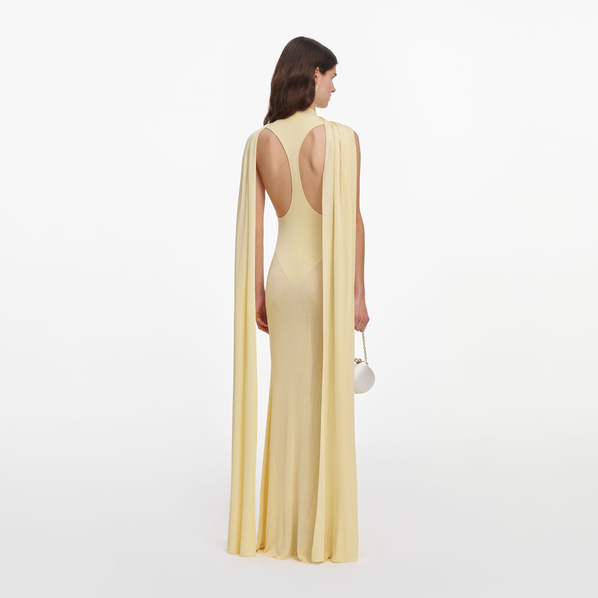 Back view of a woman wearing the Yellow Viscose Knit Scarf Maxi Dress