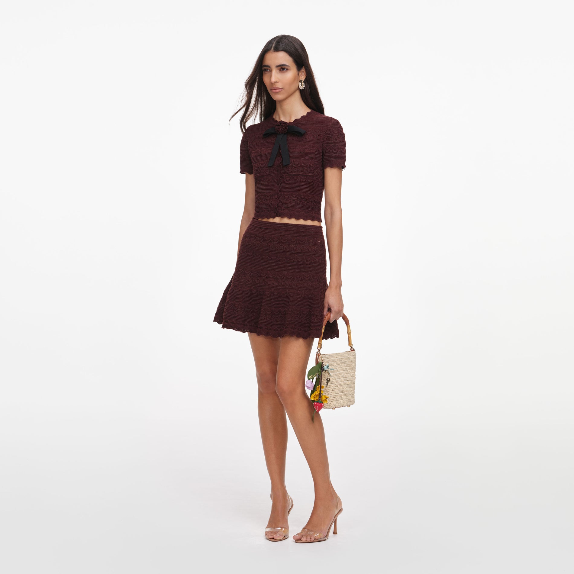 Side view of a woman wearing the Brown Pointelle Knit Mini Skirt