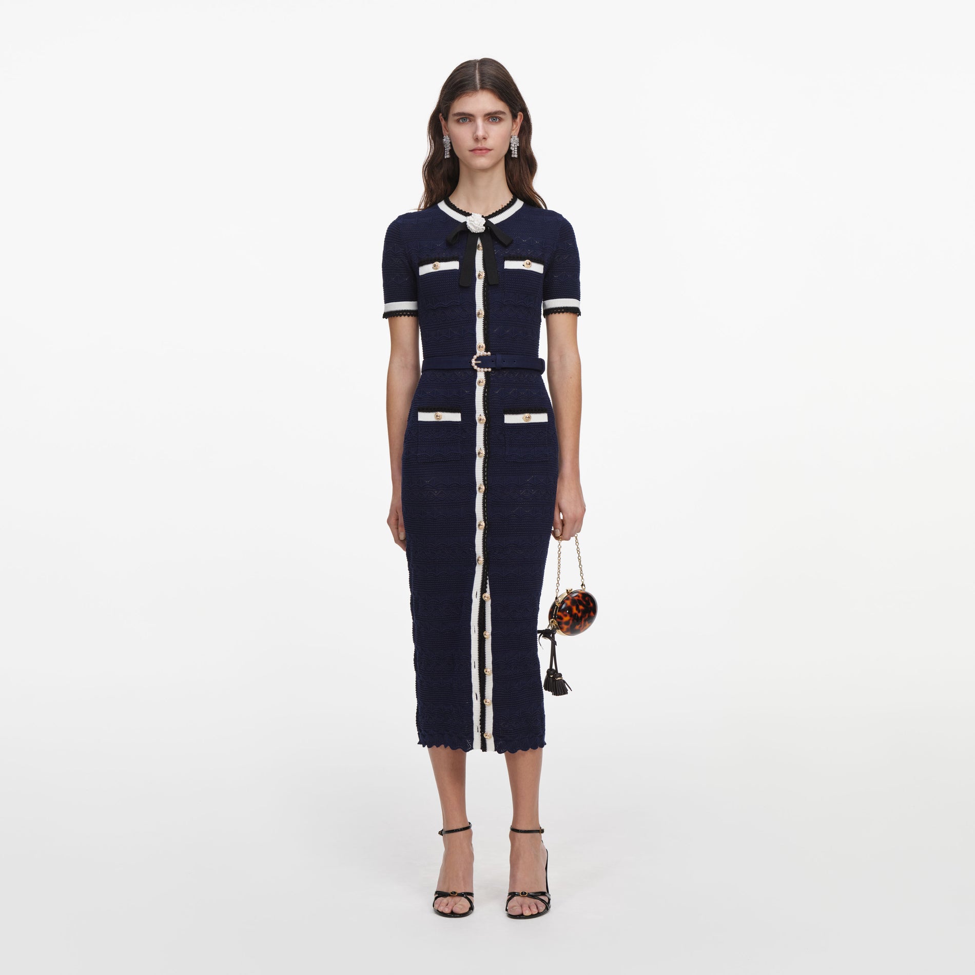 Front view of a woman wearing the Navy Pointelle Knit Midi Dress