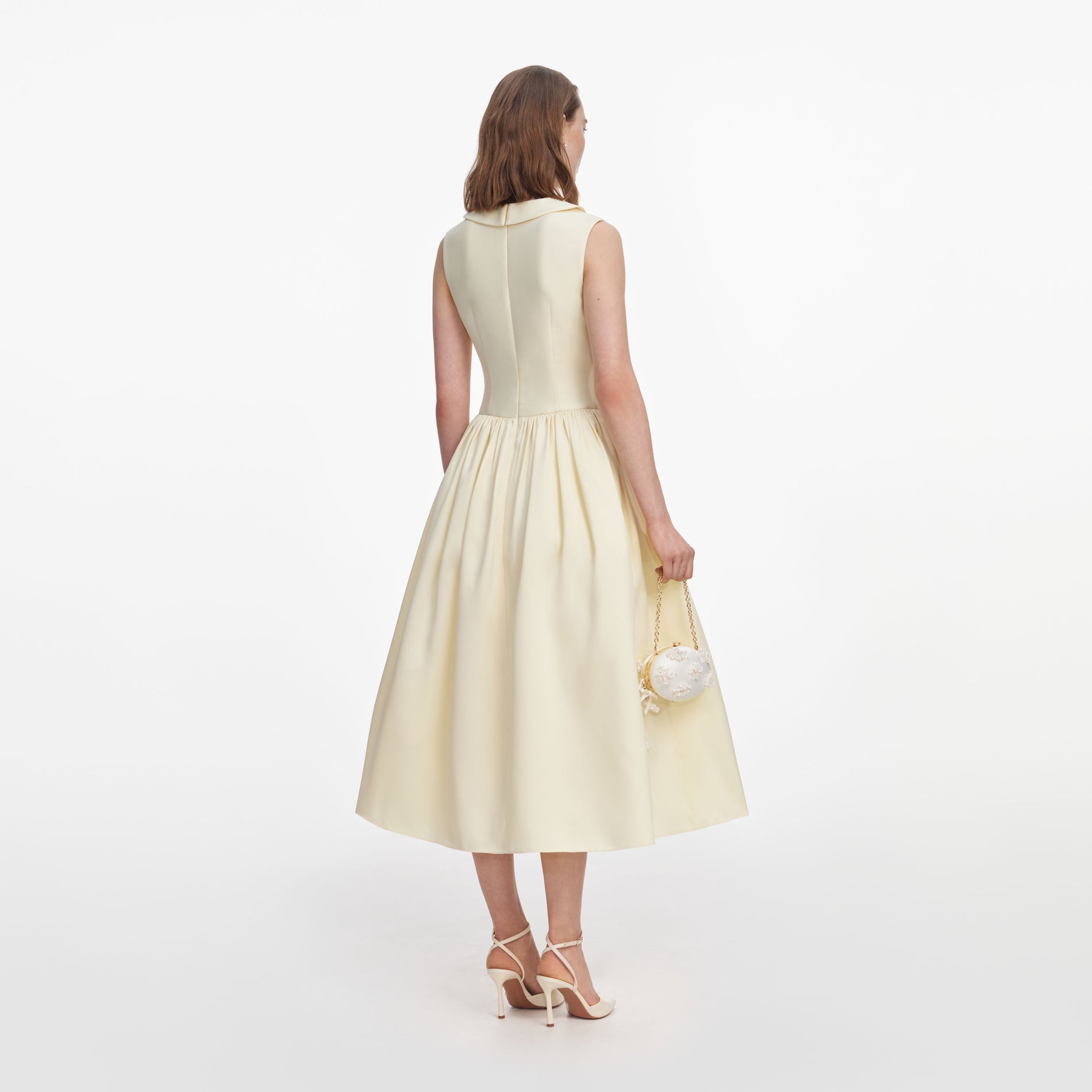 Back view of a woman wearing the Yellow Taffeta Collared Midi Dress