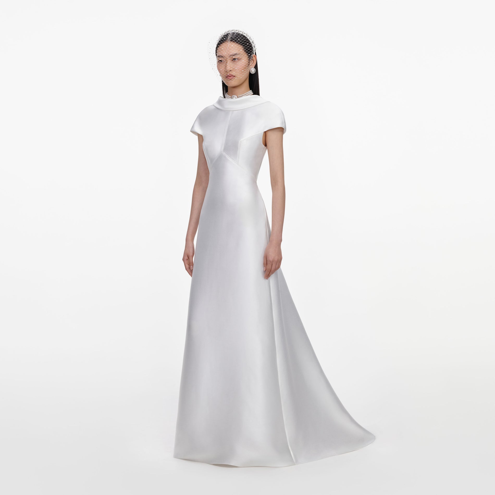 Side view of a woman wearing the White Taffeta Collared Maxi Dress