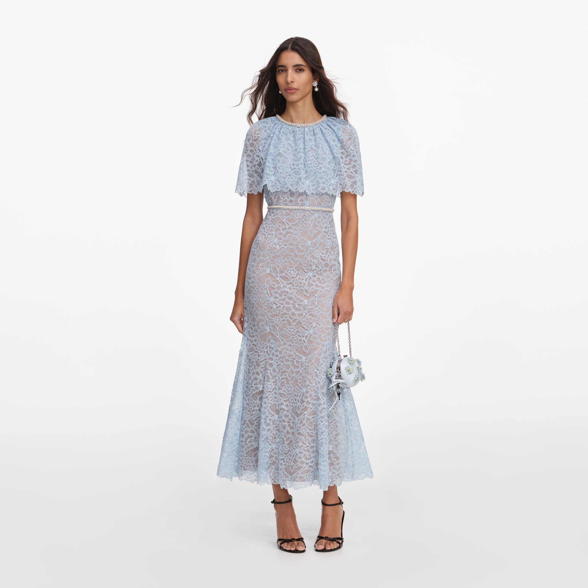 Front view of a woman wearing the Blue Lace Cape Midi Dress