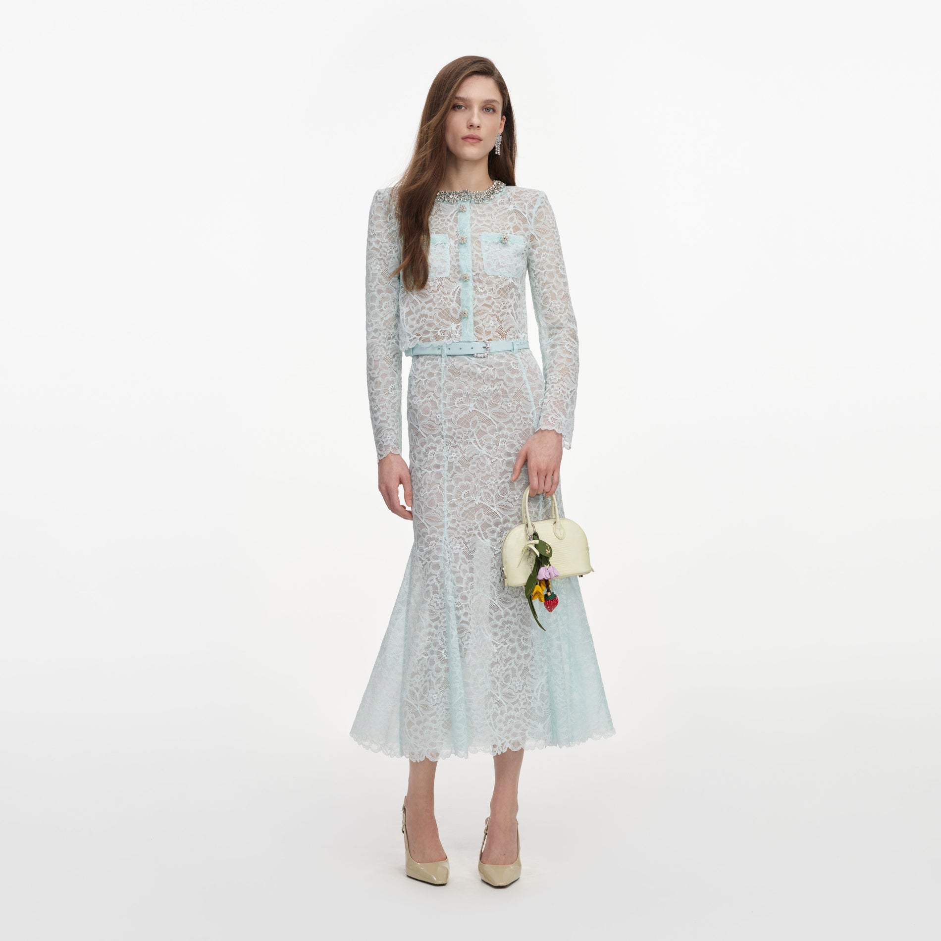 Front view of a woman wearing the Mint Lace Midi Skirt