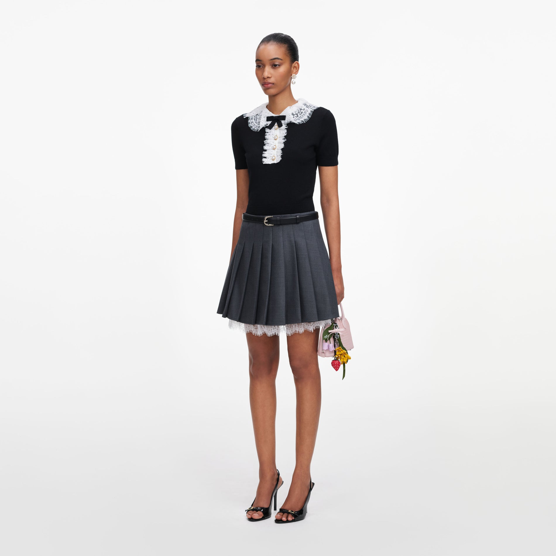 Side view of a woman wearing the Black Knit Lace Collar Top