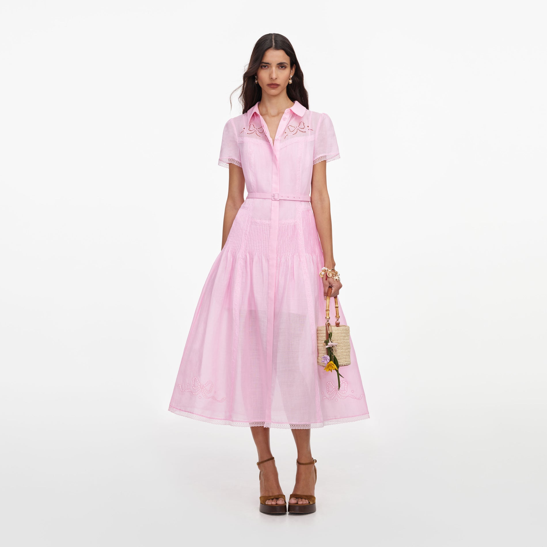 Front view of a woman wearing the Pink Embroidered Midi Dress