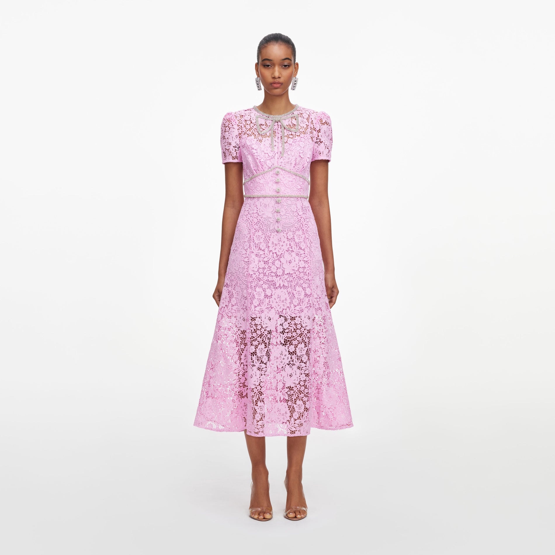 Front view of a woman wearing the Pink Cord Lace Midi Dress