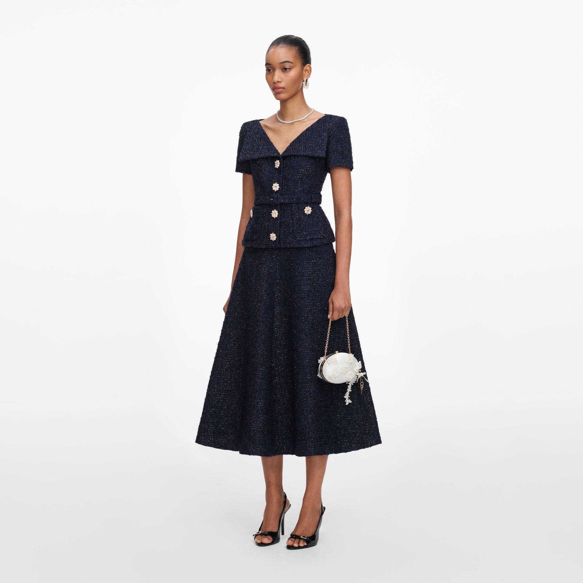 Side view of a woman wearing the Navy Boucle Tailored Midi Dress