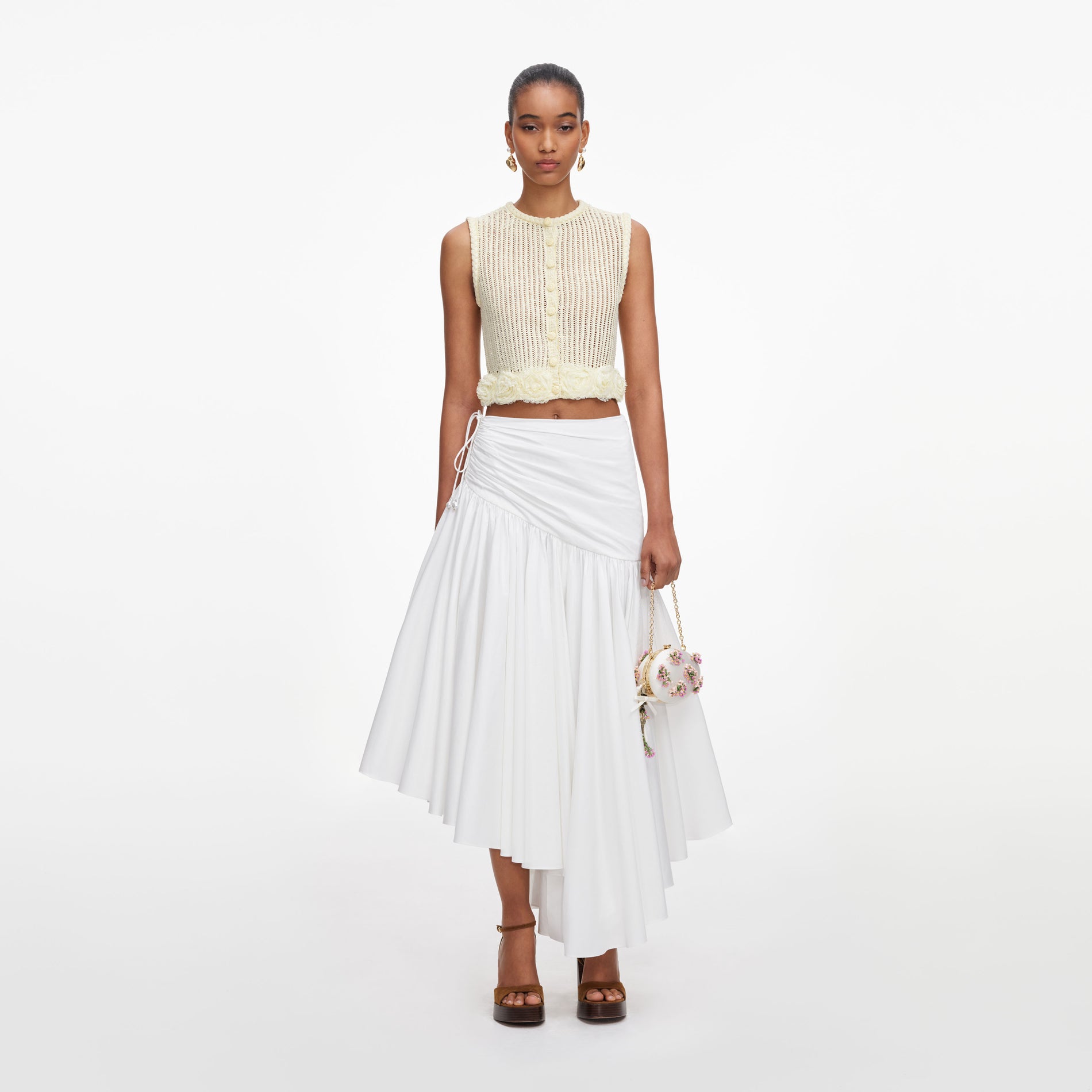 Front view of a woman wearing the Yellow Crochet Flower Knit Top