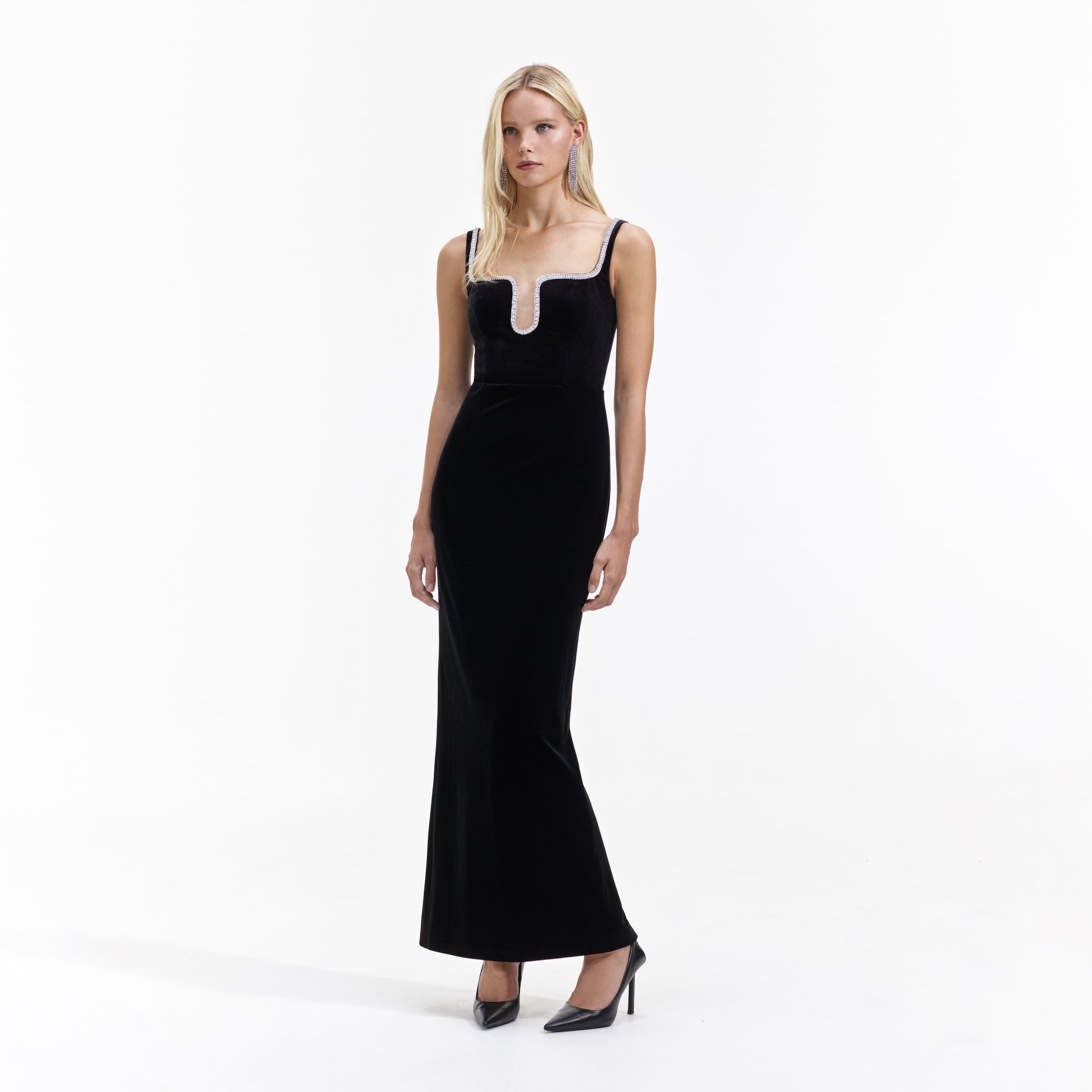 Side view of a woman wearing the Black Velvet Maxi Dress