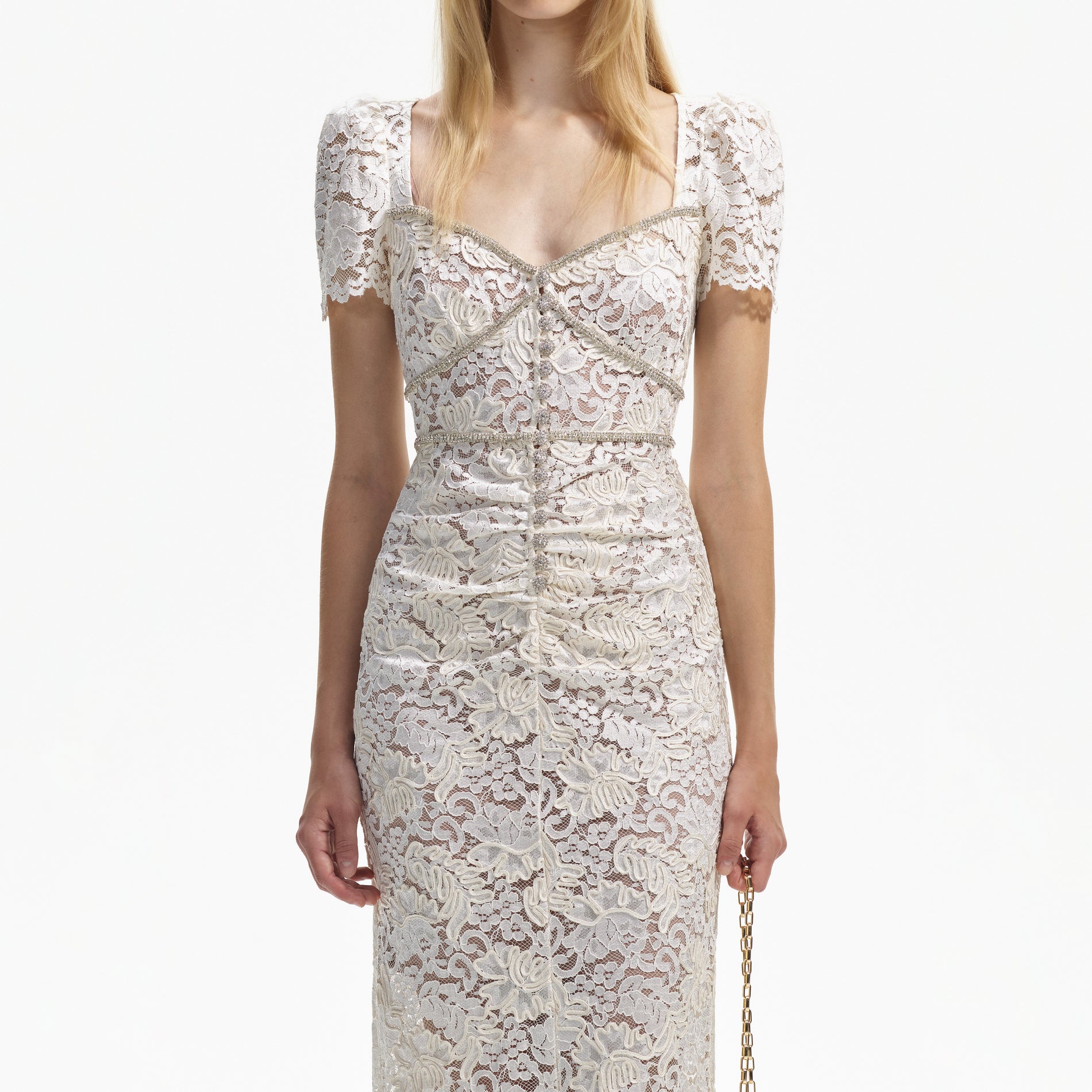 A close up of a woman wearing the Cream Cord Lace Midi Dress