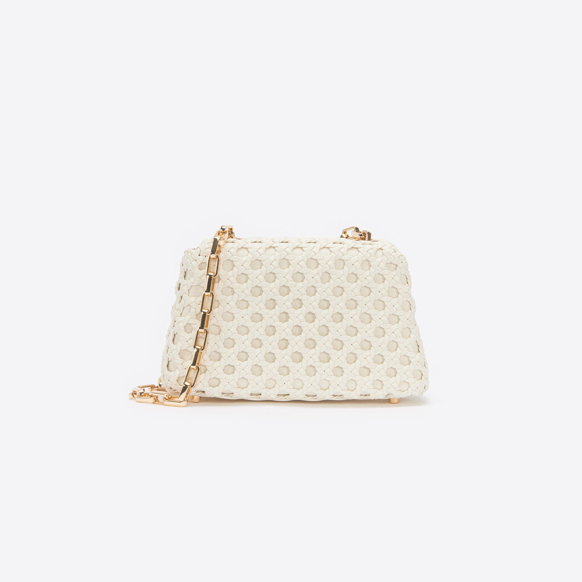 Back view of a woman wearing the Cream Woven Leather Bag