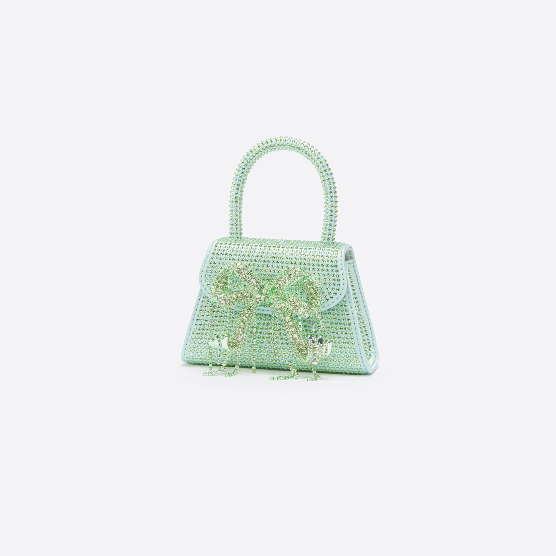 Side view of a woman wearing the Green Satin Rhinestone Micro Bow Bag