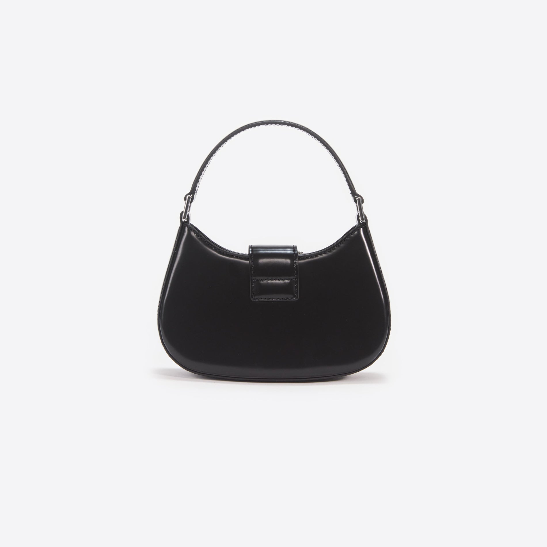 Side view of a woman wearing the Black Leather Crescent Bag