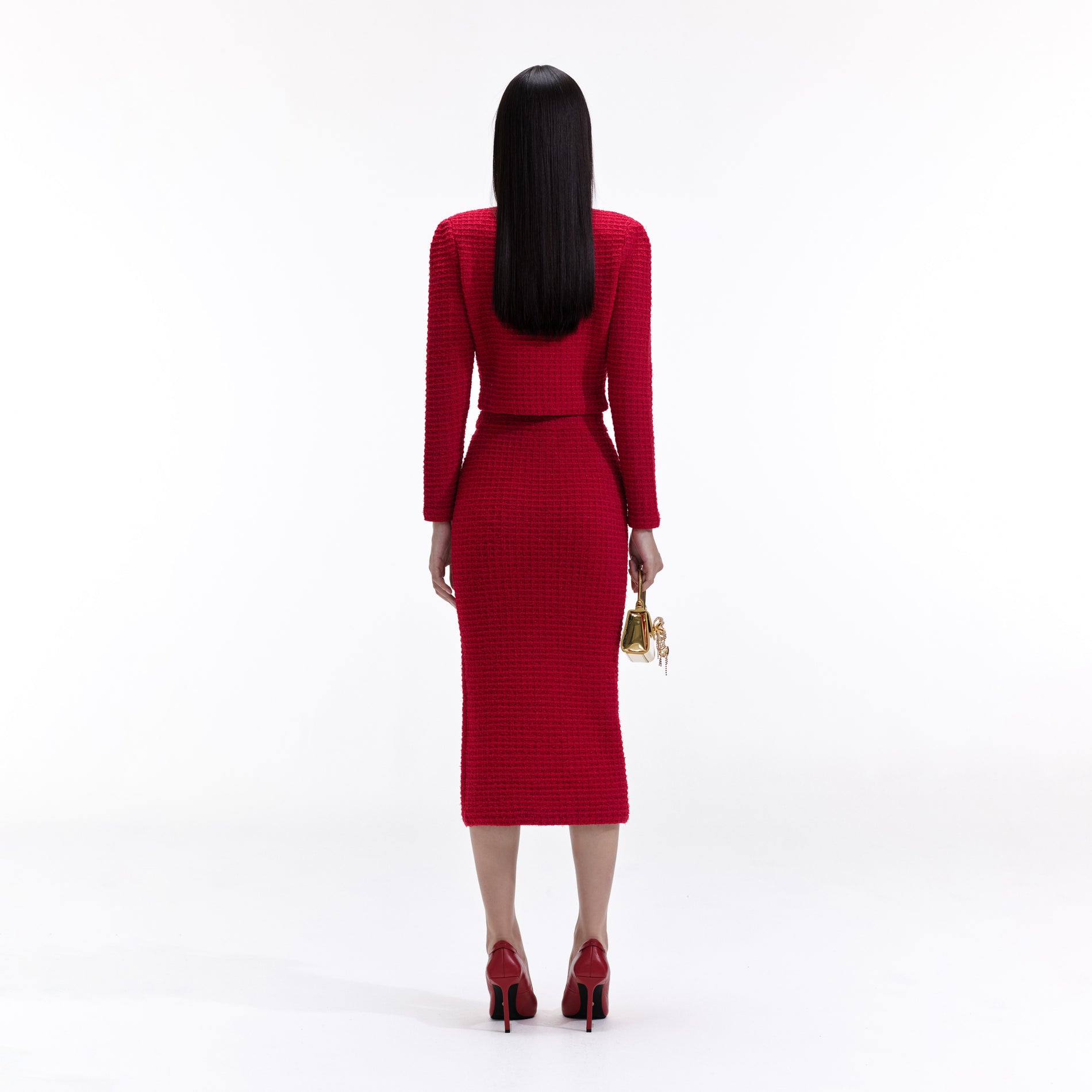 Back view of a woman wearing the Red Knit V Neck Cardigan