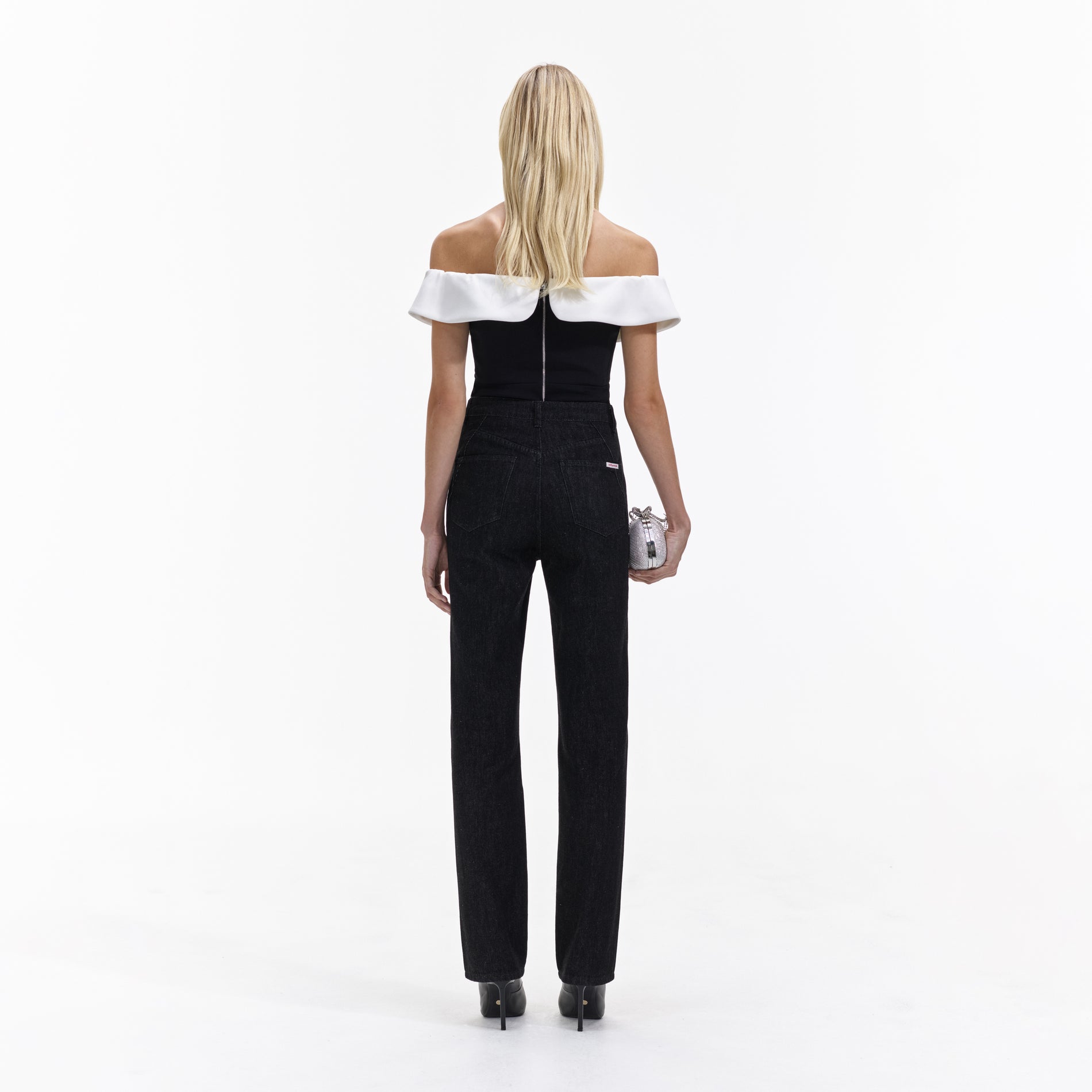 Back view of a woman wearing the Black Crepe Bow Top